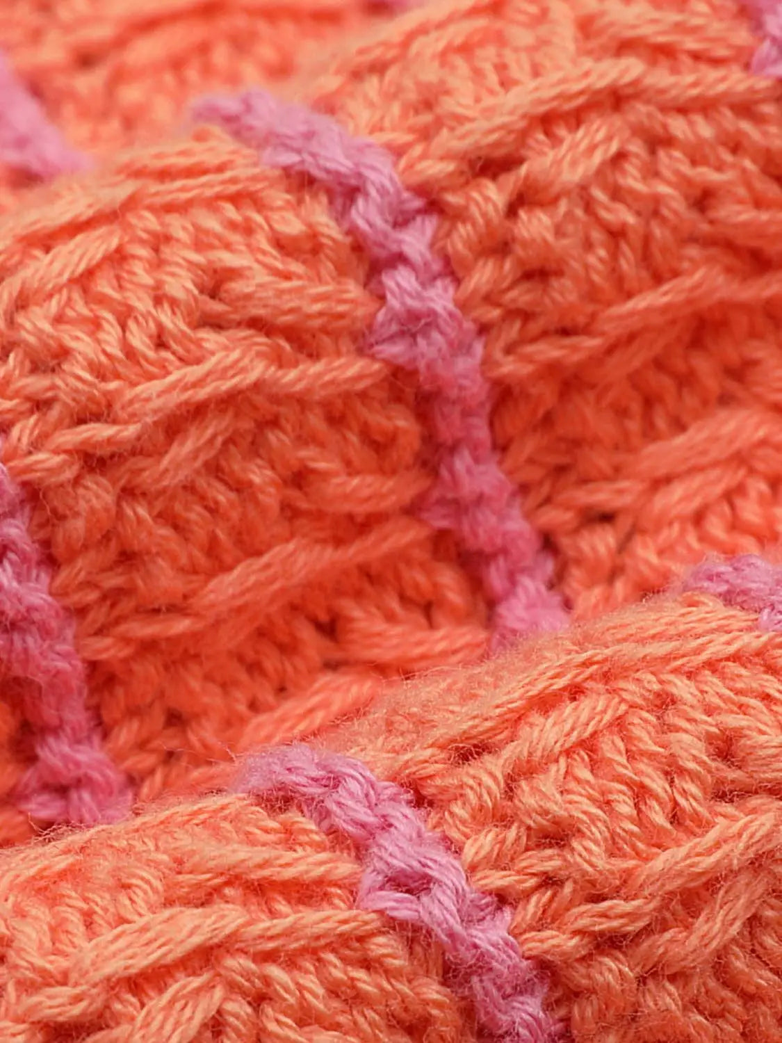 Knit T-Shirt fabric in bright orange with pink stripe, chunky knitted texture.