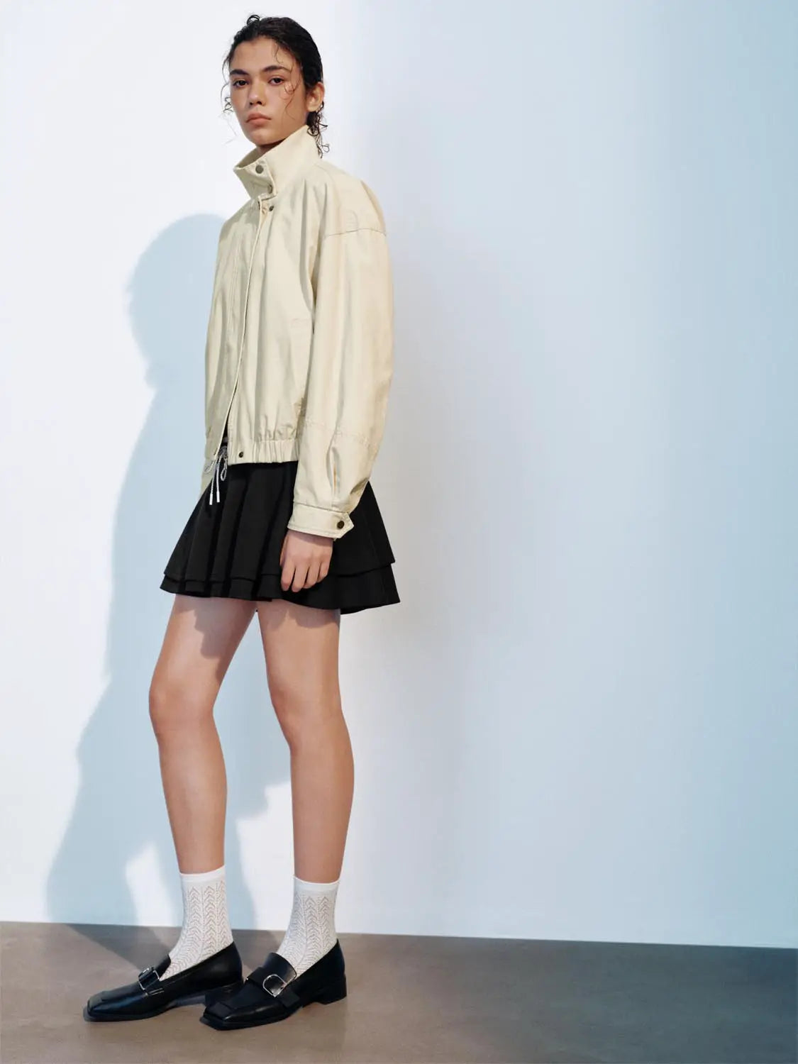Padded jacket beige by Urban Revivo Fashion with drawstring hem and elastic cuffs; shown with a black mini skirt.