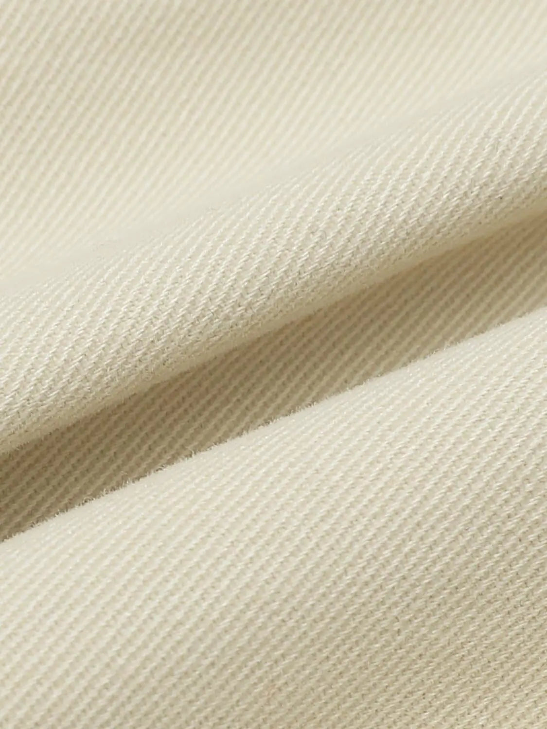 Padded Jacket beige fabric close-up by Urban Revivo Fashion