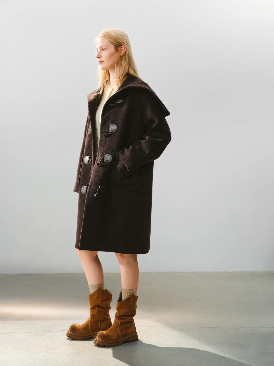 Coat dark brown duffle with oversized collar and toggle closures.