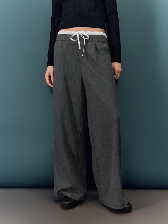 Pantaloni a gamba larga con fiocco decorativo