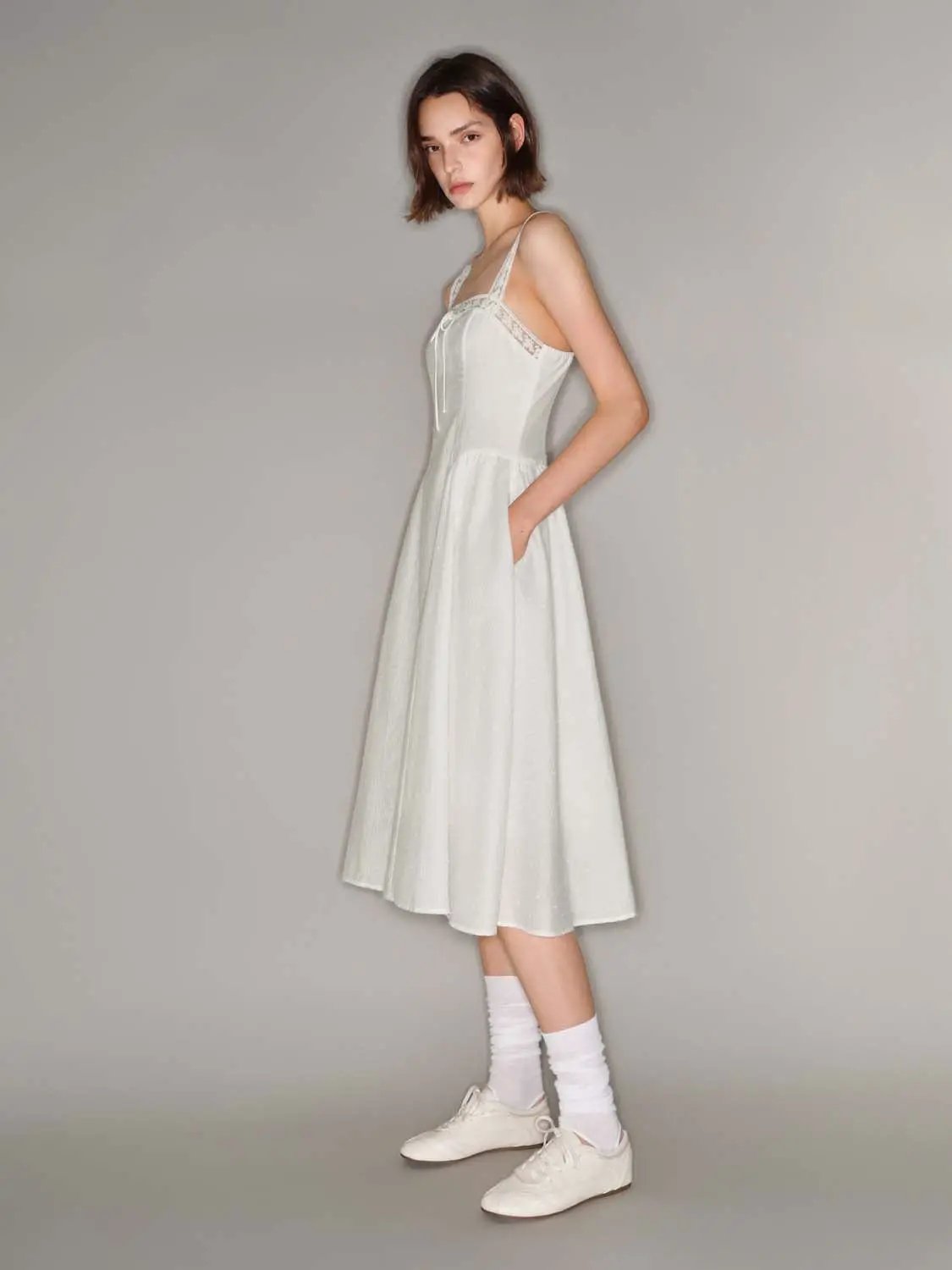 Cotton lace-trim dress with thin straps, front tie, A-line silhouette in white