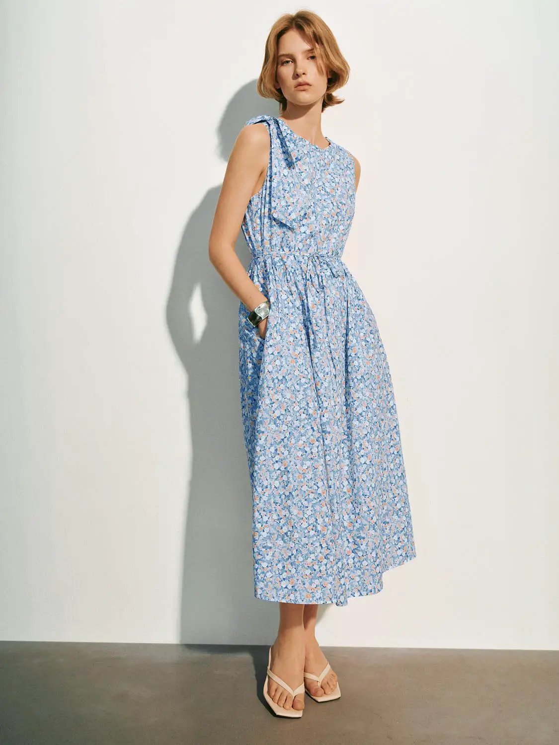A-Line Dress by Urban Revivo Fashion in blue floral print, sleeveless with gathered waist and pockets
