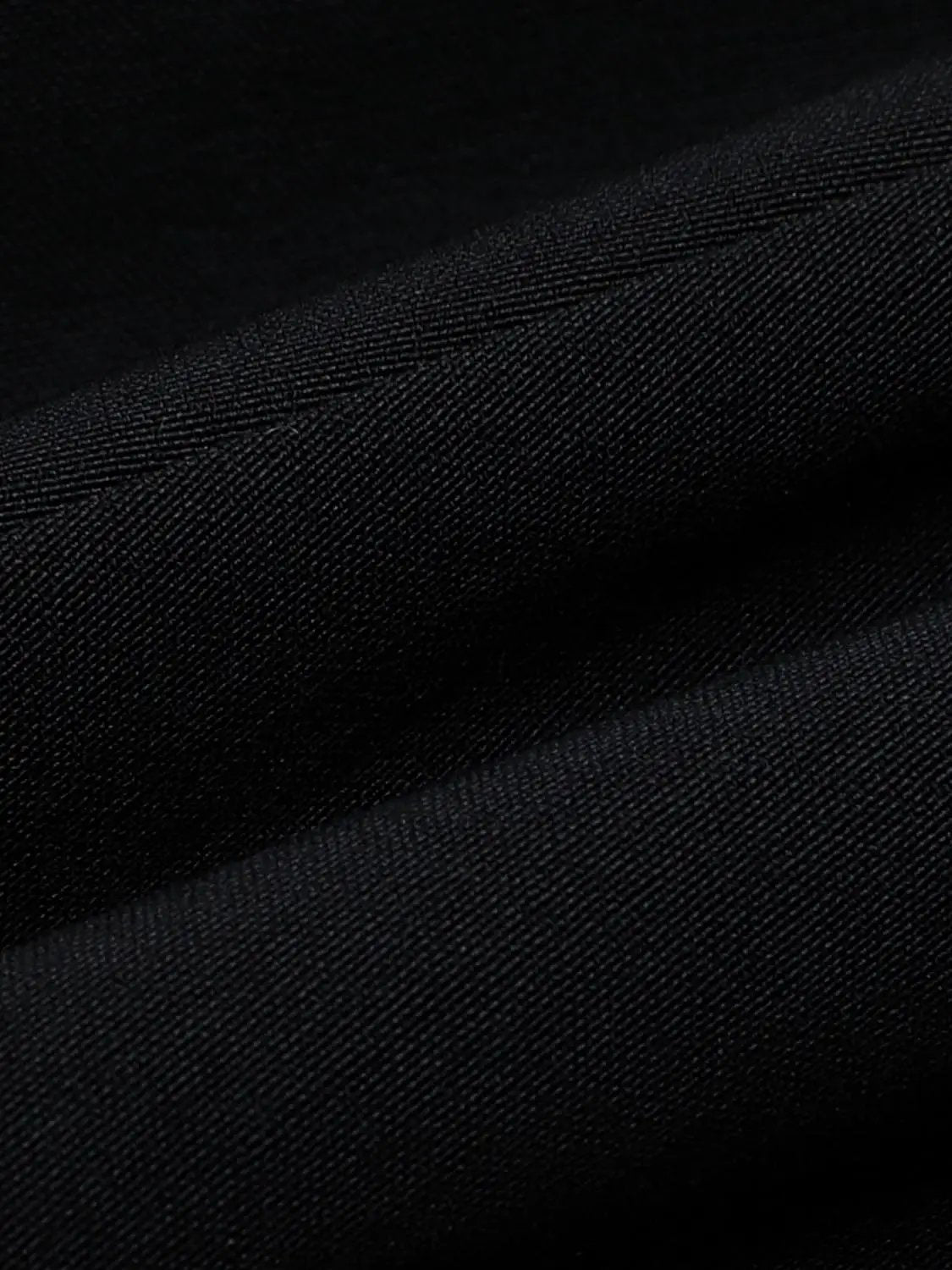 A-line sleeveless square-neck black dress by Urban Revivo Fashion; black denim-like fabric close-up