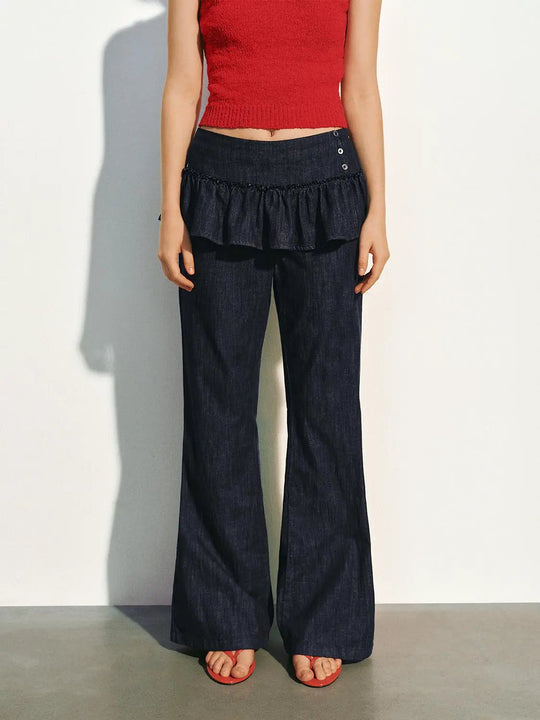 Pantaloni a gamba larga in denim misto cotone con volant in vita e bottoni laterali