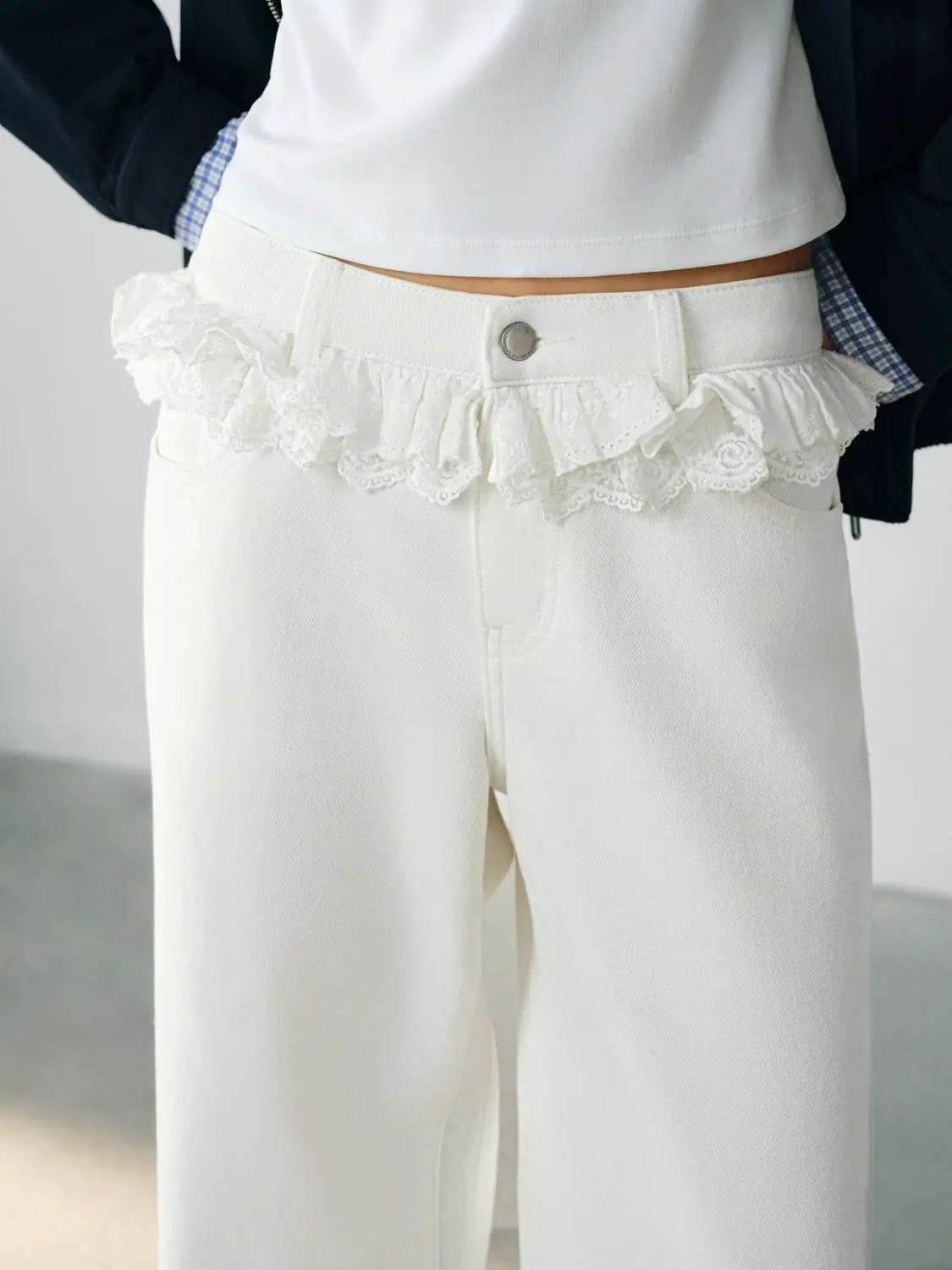 Casual white jeans with lace-trimmed waistband and silver button