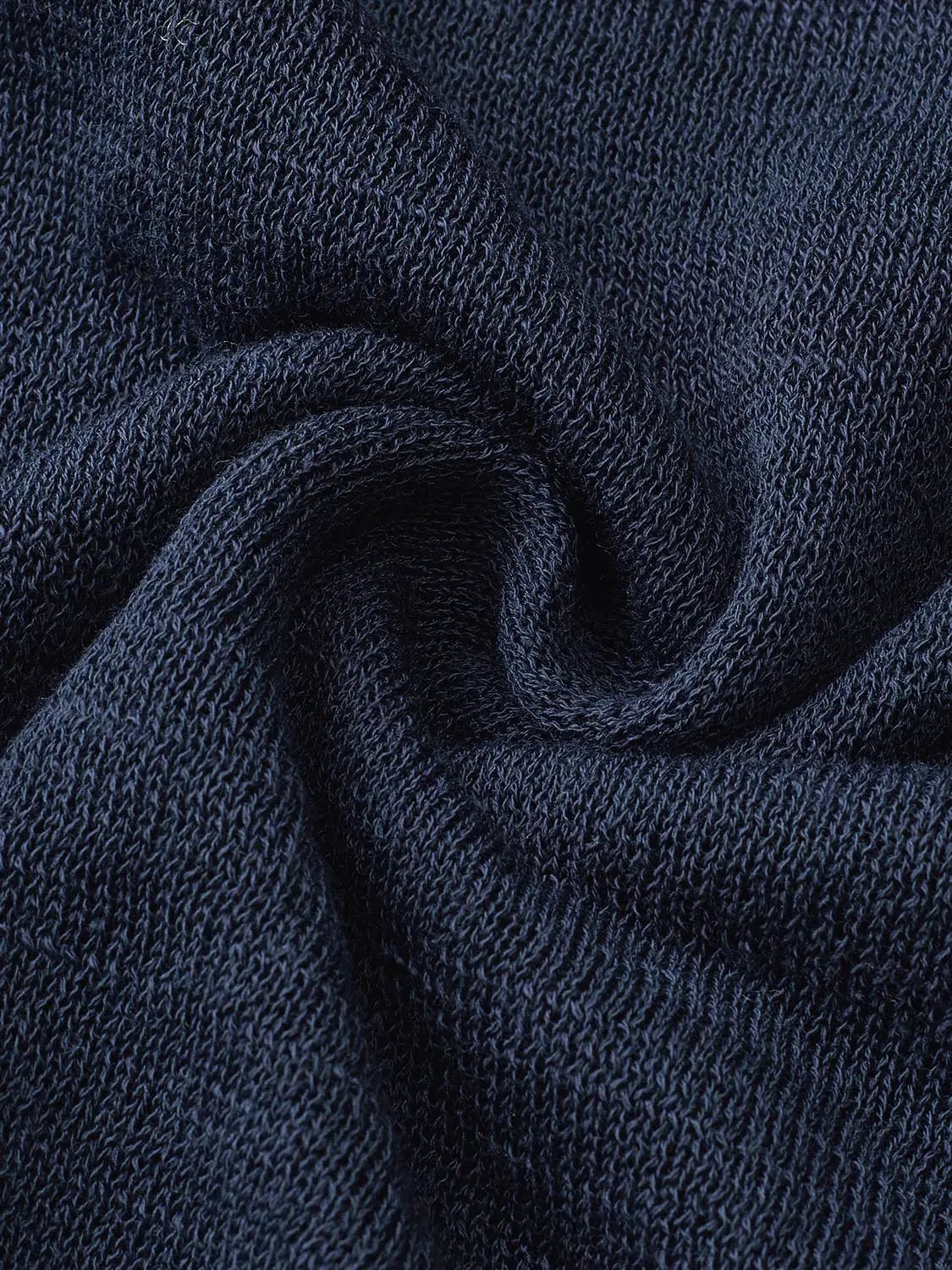 Knit T-Shirt navy blue knit fabric close-up, showing textured fibers.