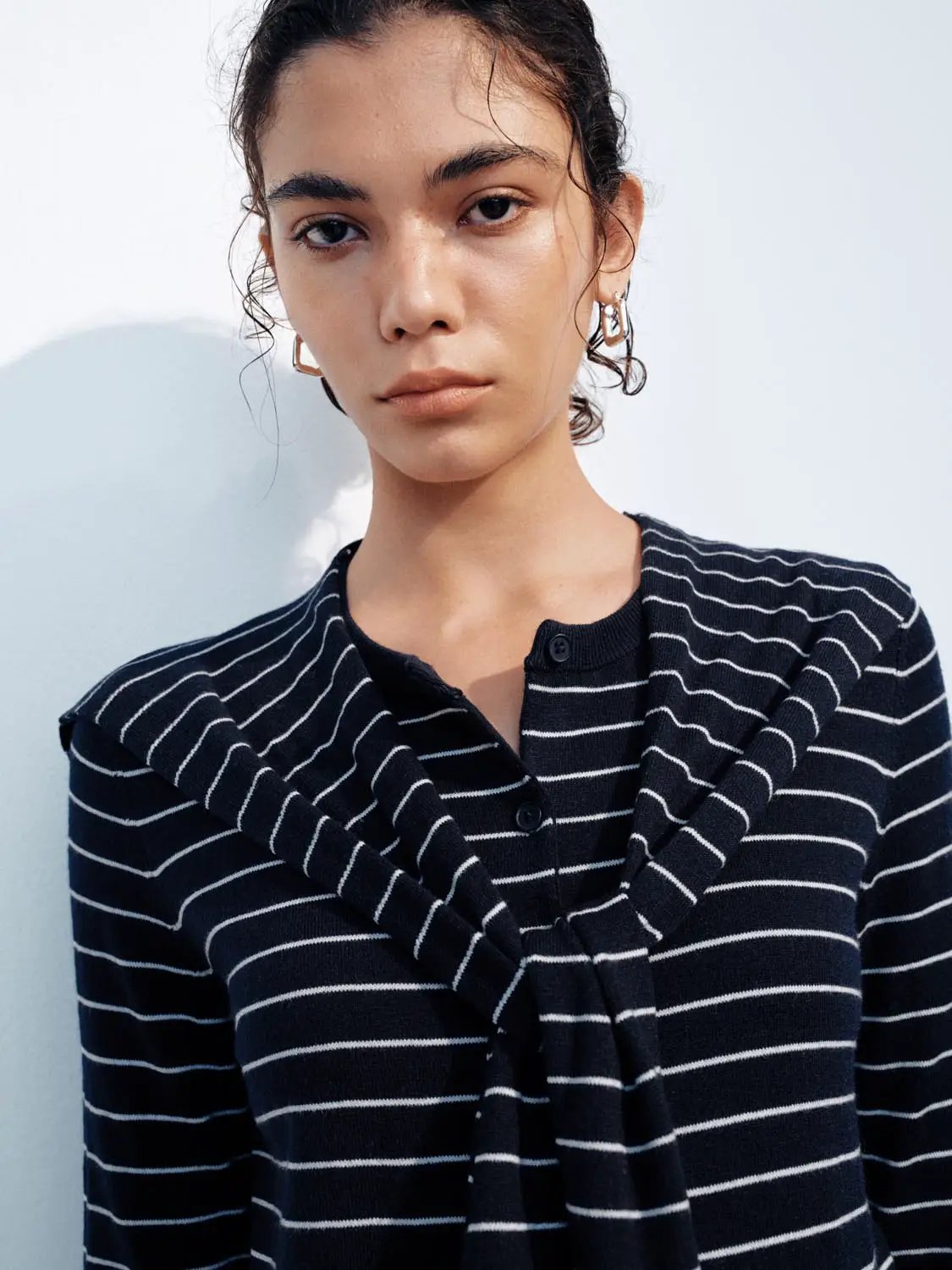 Knit cardigan in navy with white horizontal stripes; soft lightweight knit fabric with classic striped design.