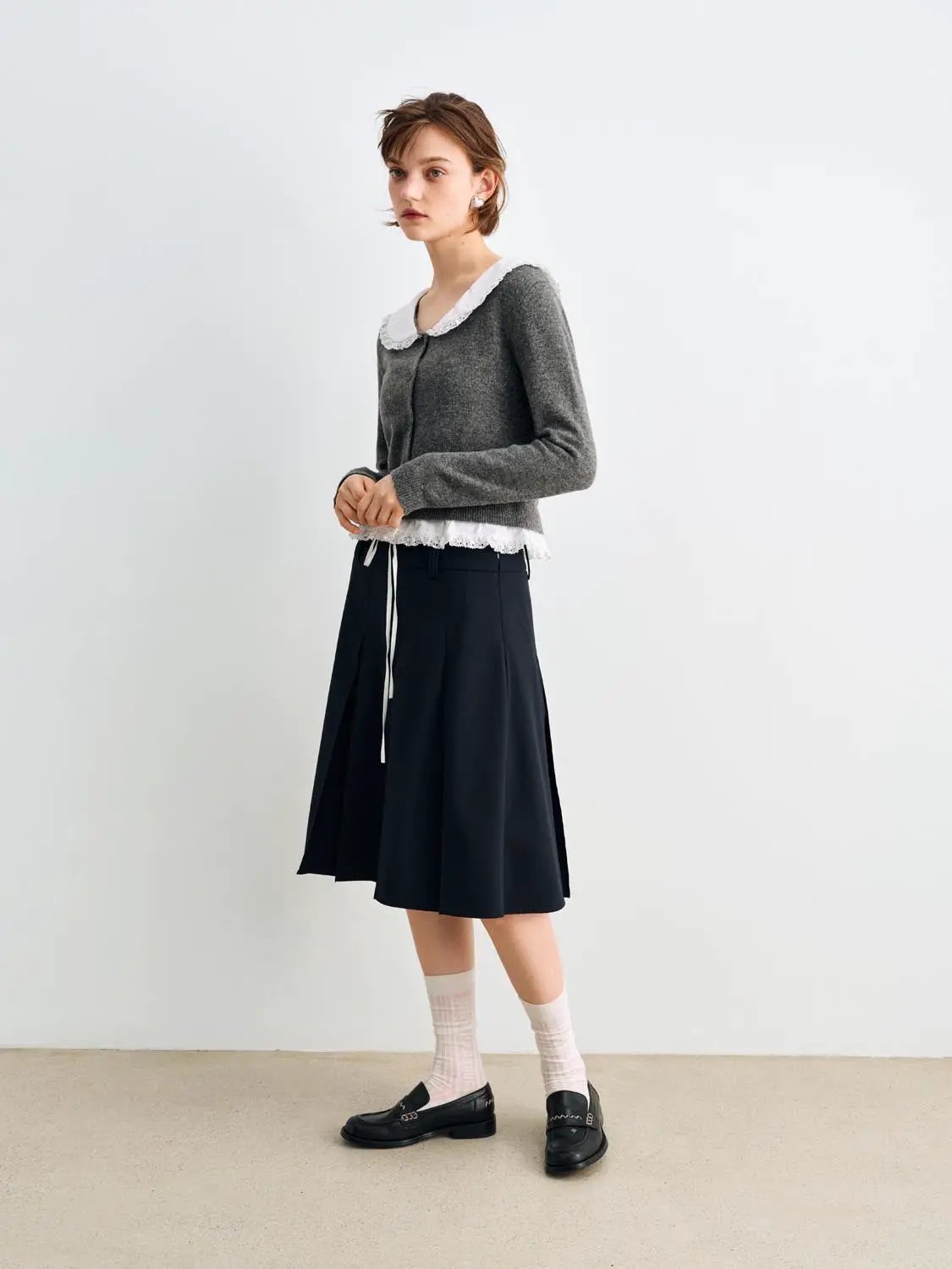 Knitted cardigan by Urban Revivo Fashion; gray knit with white lace collar.