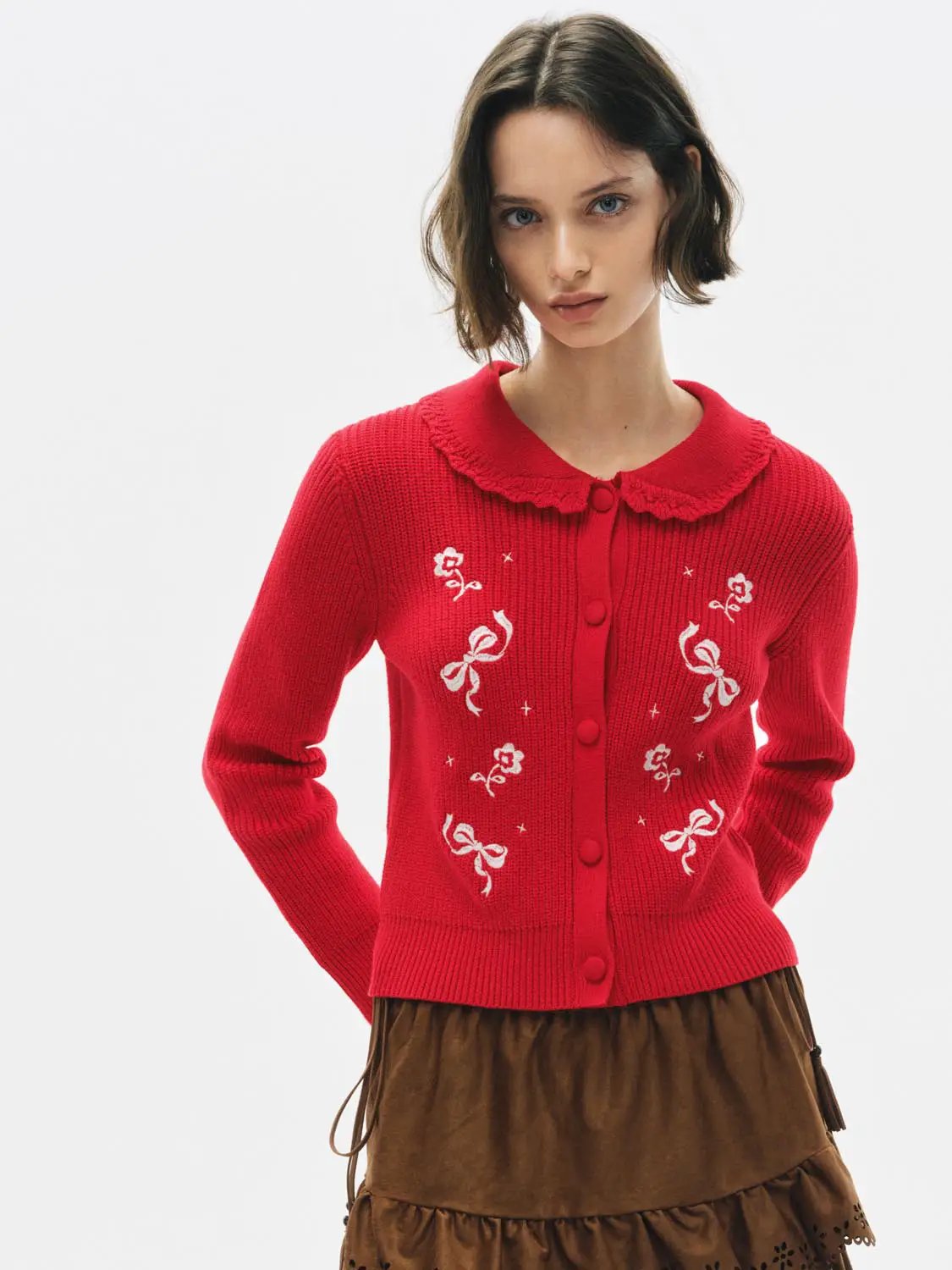Knitted cardigan in red with a ruffled collar, white floral embroidery and bow accents, Urban Revivo Fashion.