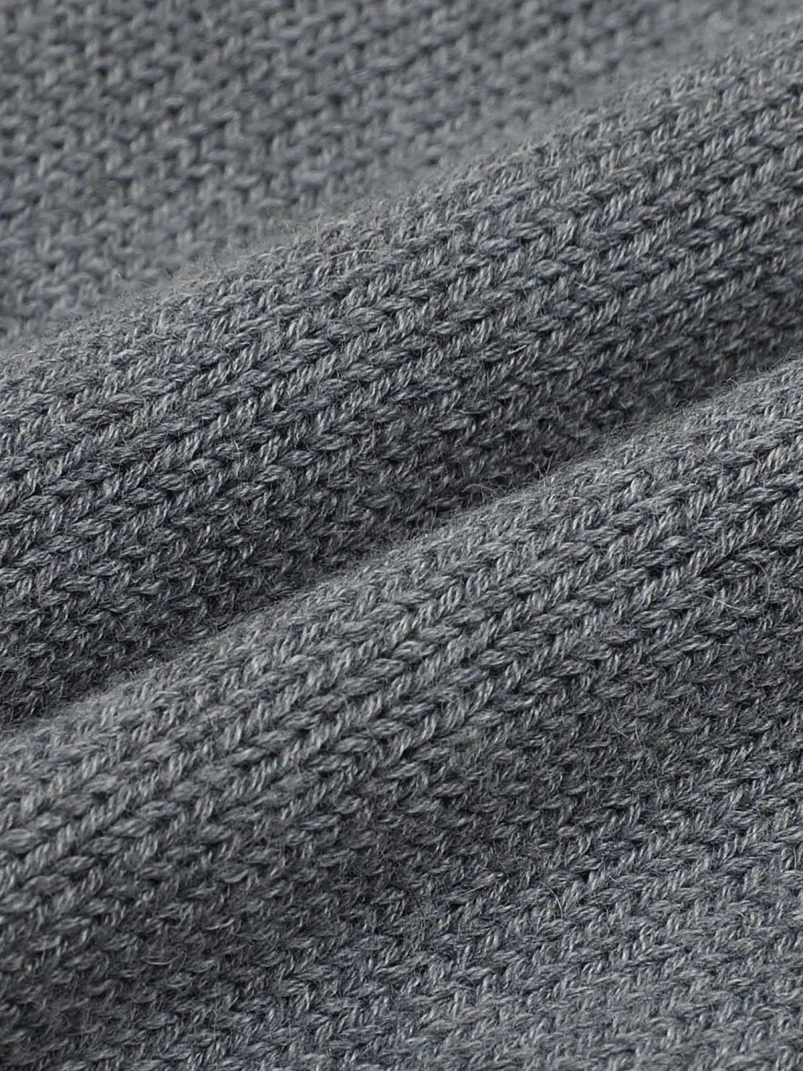 Graphic long sleeve ribbed knit cardigan in gray knit fabric, close-up texture