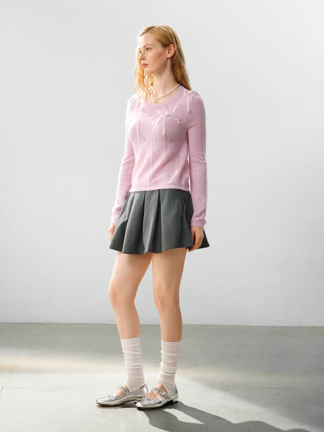 Bow-detail textured crew-neck knit sweater in light pink by Urban Revivo, long sleeves.