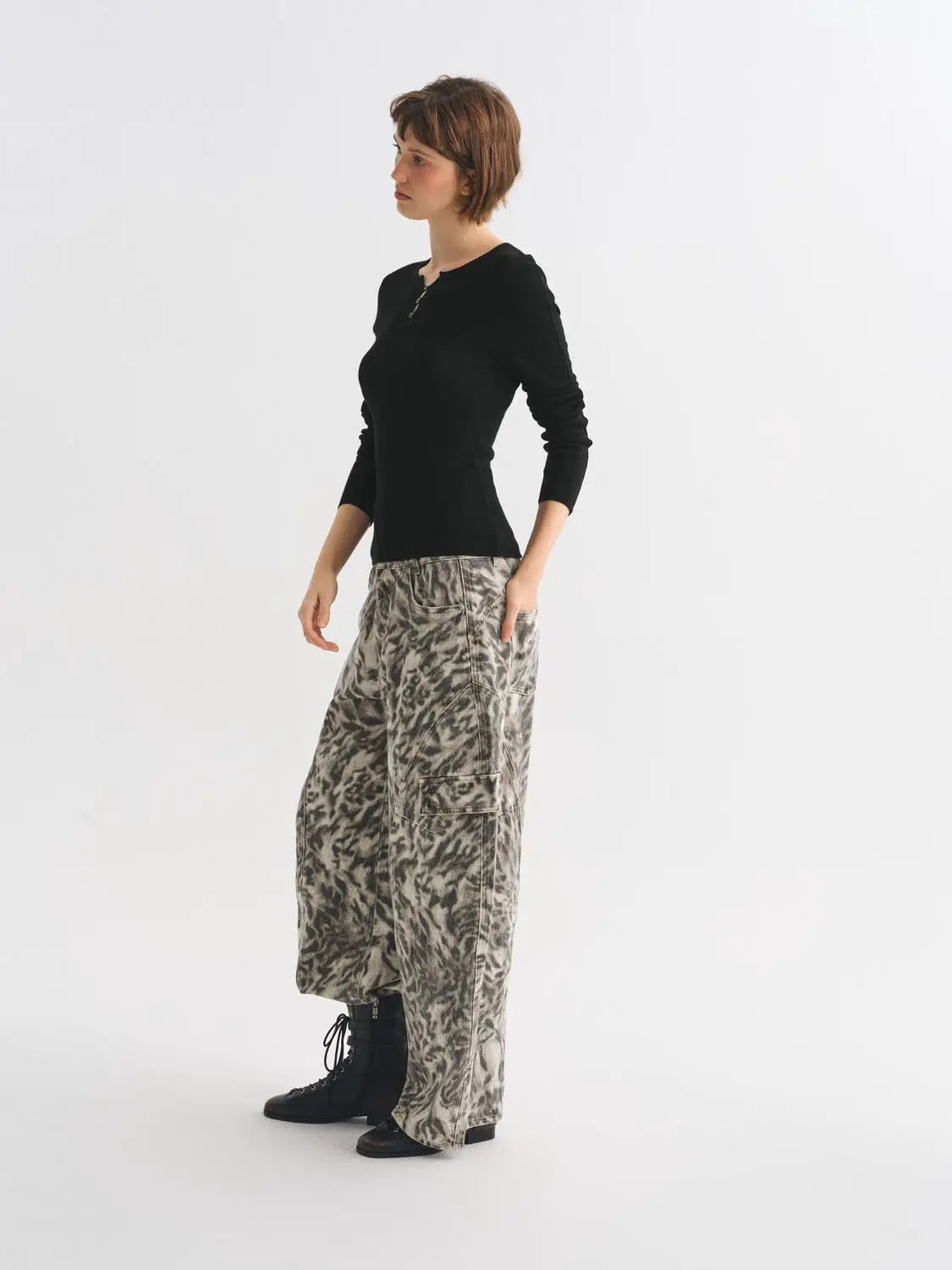 Knit T-Shirt by Urban Revivo Fashion; black knitted top with long sleeves, worn with grey leopard-print pants and boots.