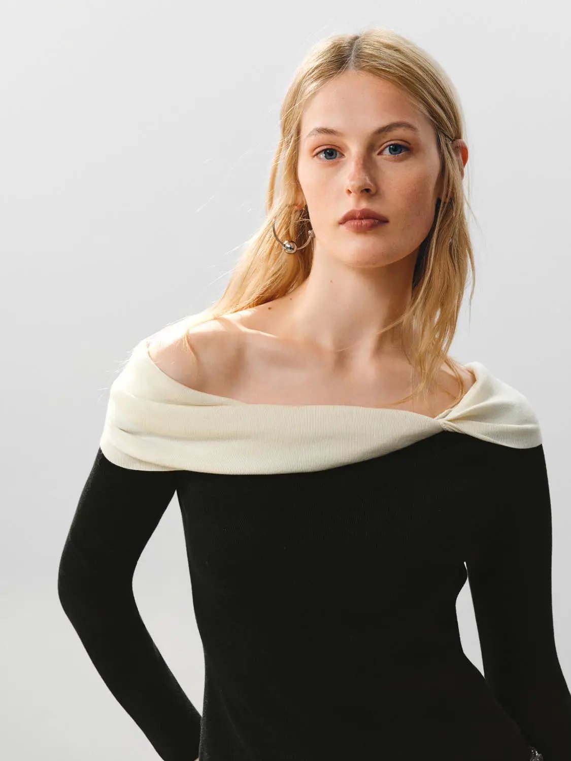 Knitted T-Shirts black knit top with ivory off-shoulder neckline