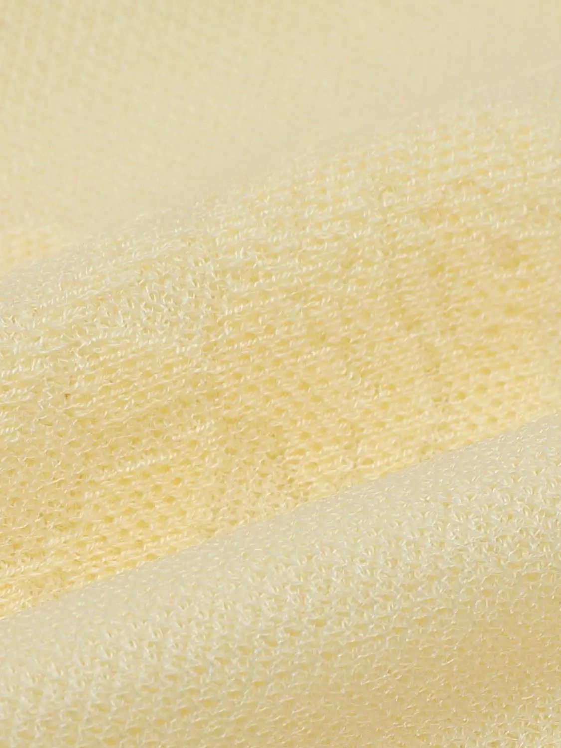 Ribbed Floral Embroidered Bow Long Sleeve Cardigan fabric close-up in pale yellow knit
