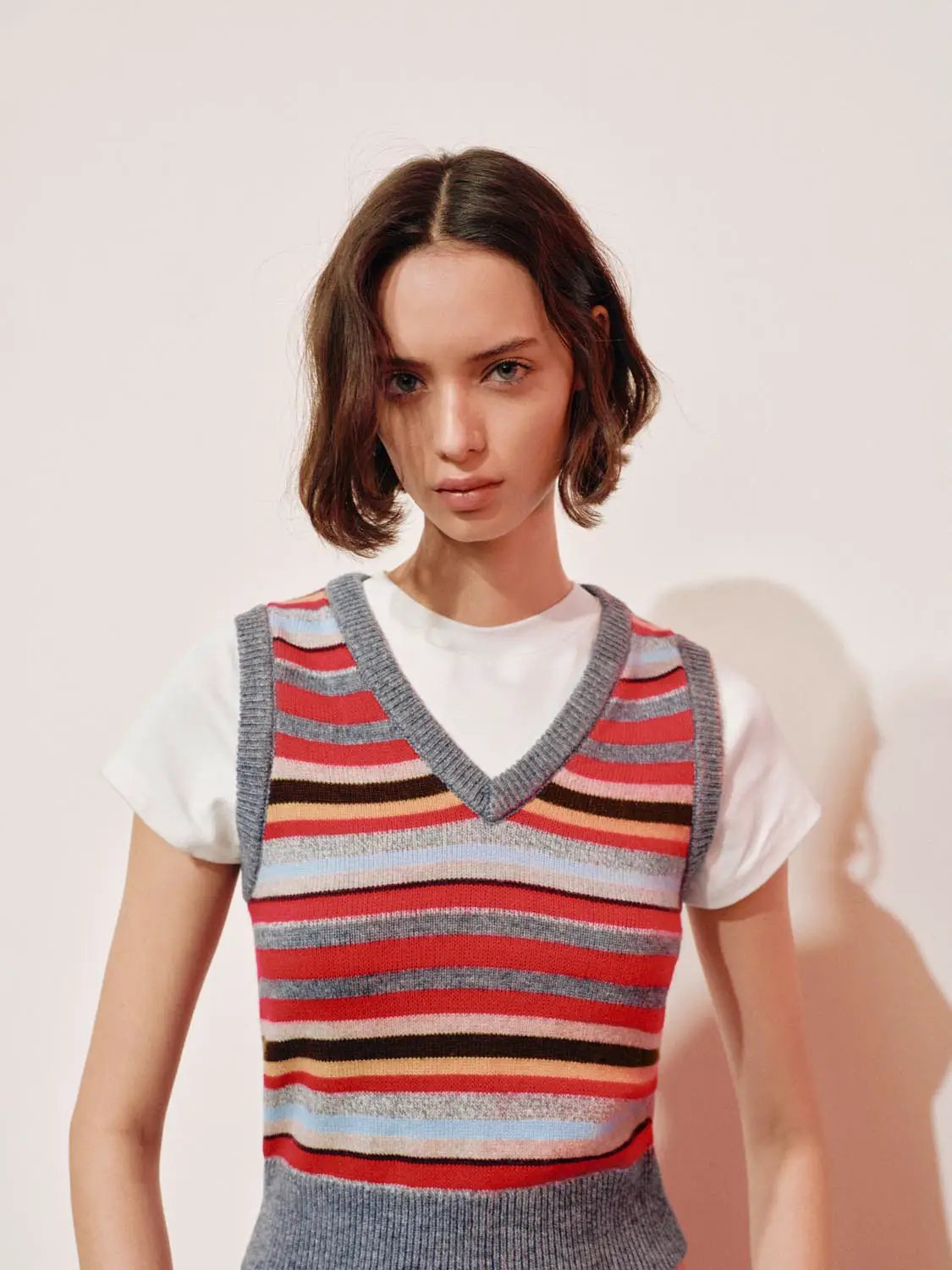 Layered Striped V-neck Knit Short Sleeve T-Shirt worn over a white tee; multicolor stripes