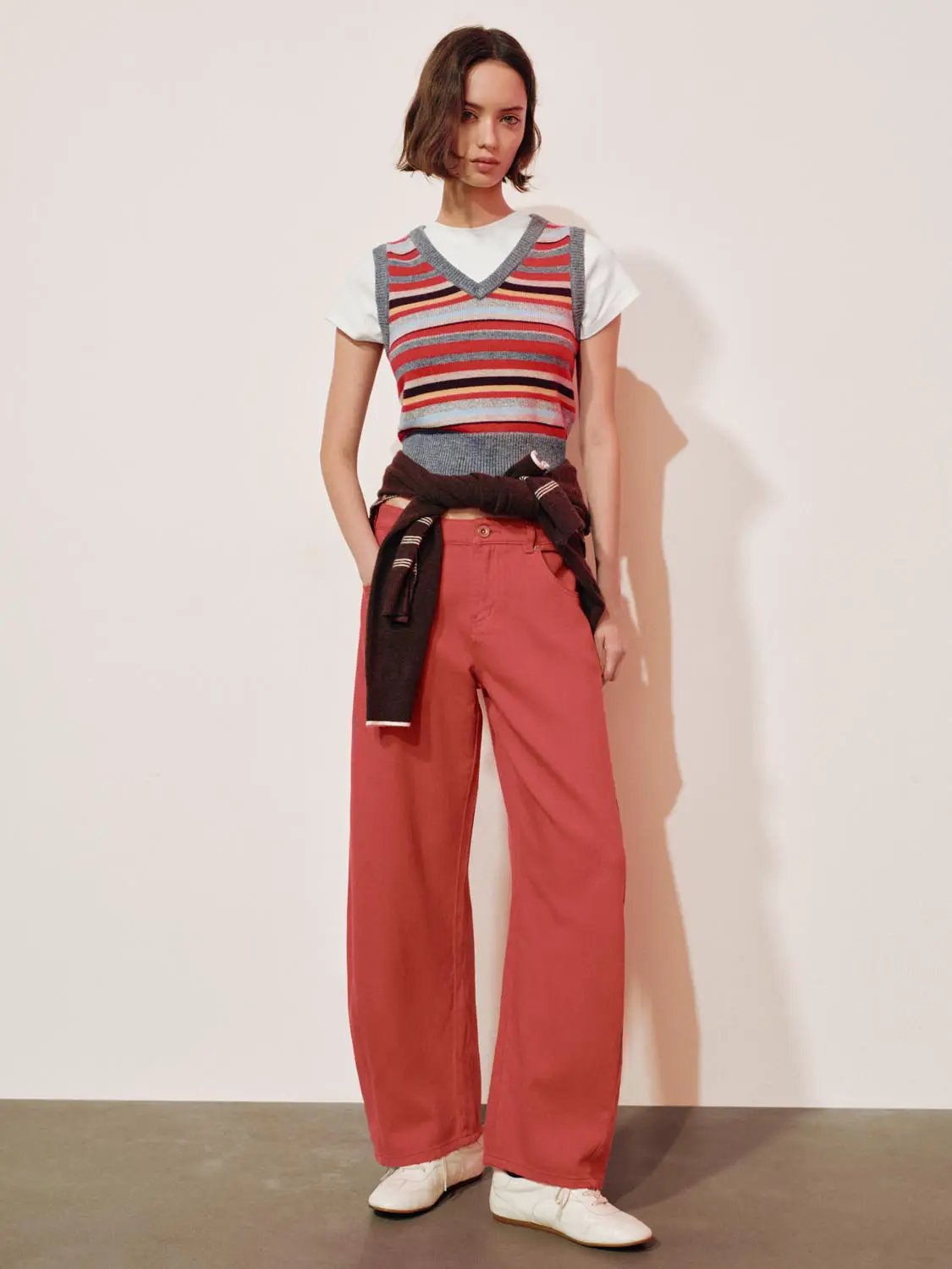 Layered Striped V-neck Knit Short Sleeve T-Shirt over white tee; coral wide-leg pants.