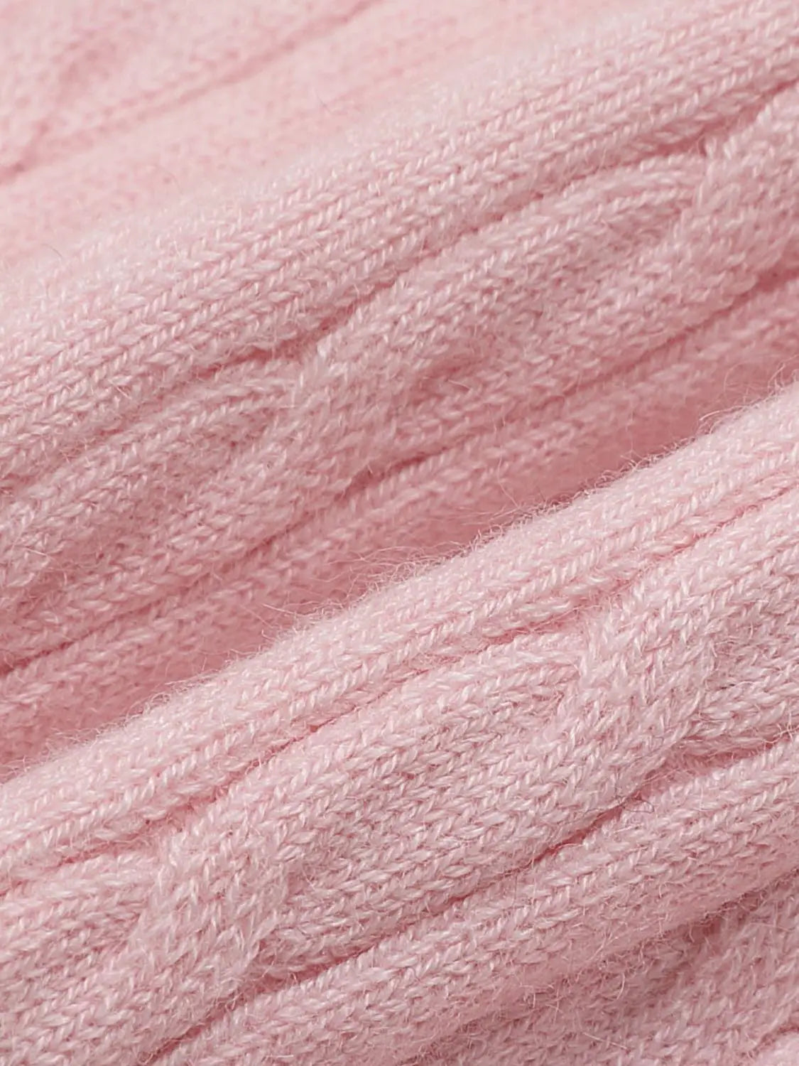 Knit Jacket soft pink knitted fabric close-up texture.