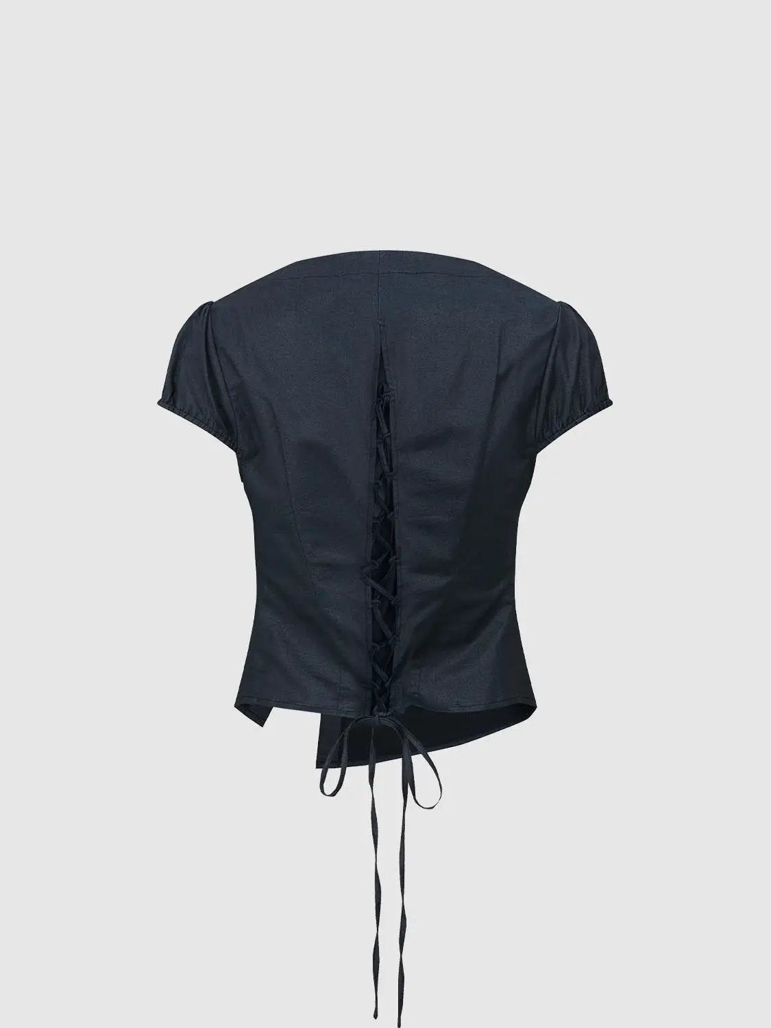 Open-front shirt in navy with back lace-up detail and short puff sleeves.