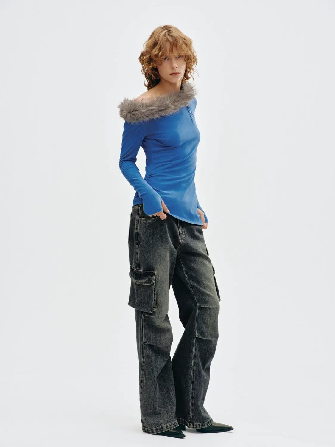 Blue long-sleeve T-shirt with gray fur-trimmed off-shoulder neckline, paired with cargo jeans