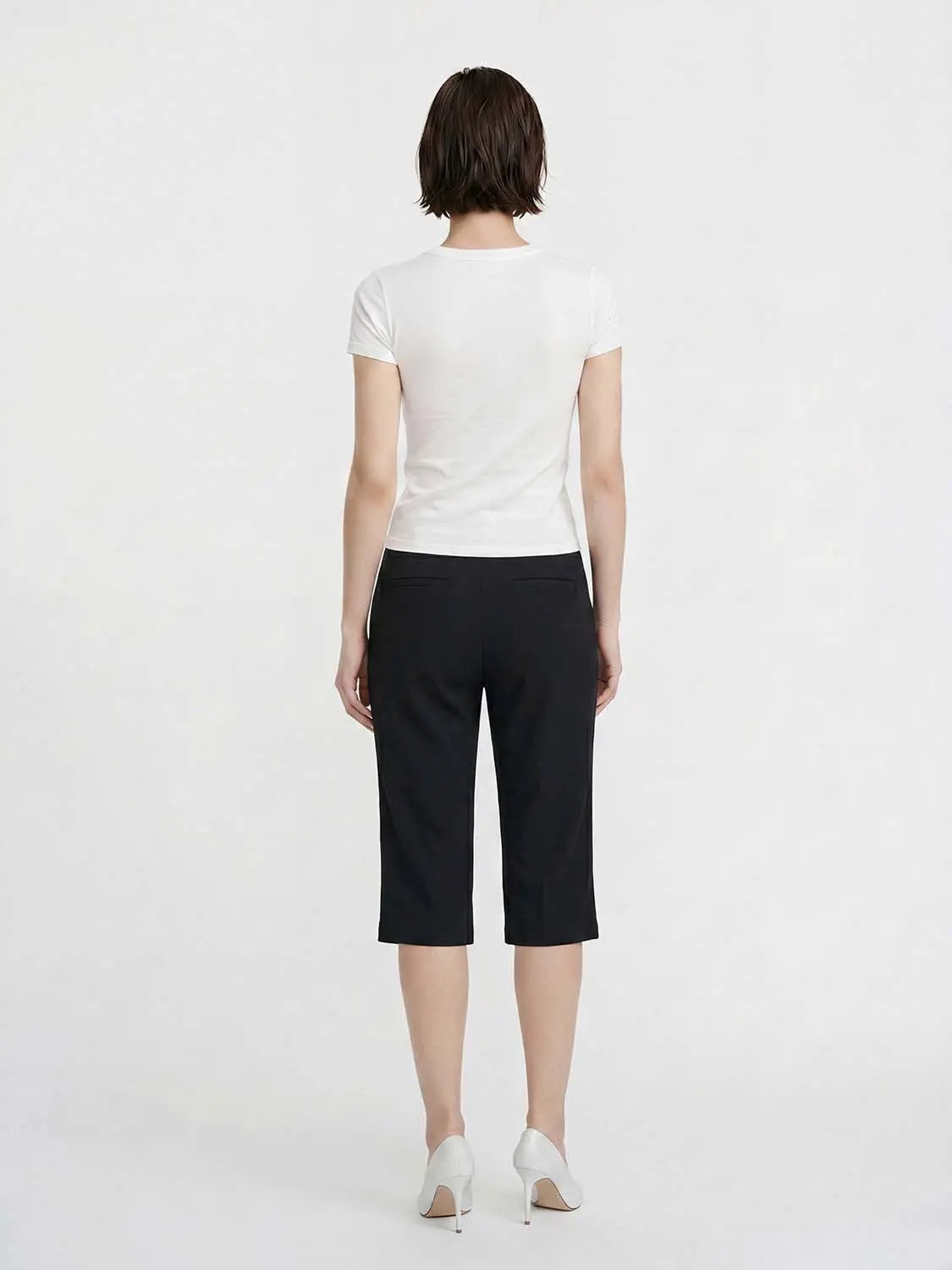 Women's straight pants by Urban Revivo Fashion in black, back view.