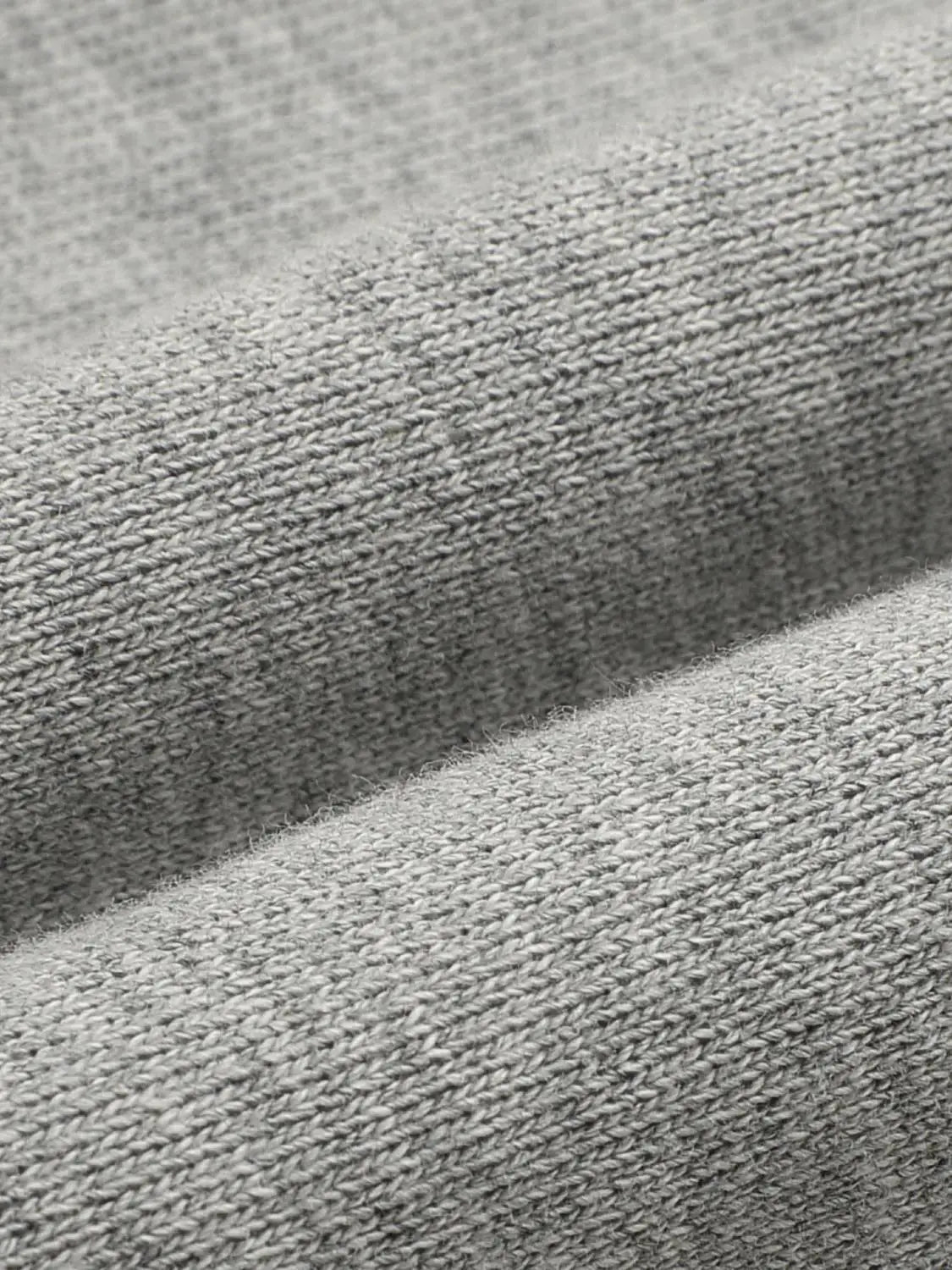 Harem pants gray knitted fabric close-up texture detail