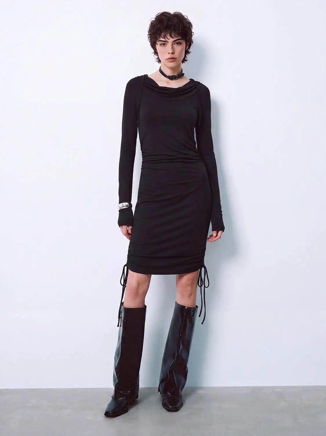 Hooded cowl neck ruched drawstring slim fit mini dress in black.