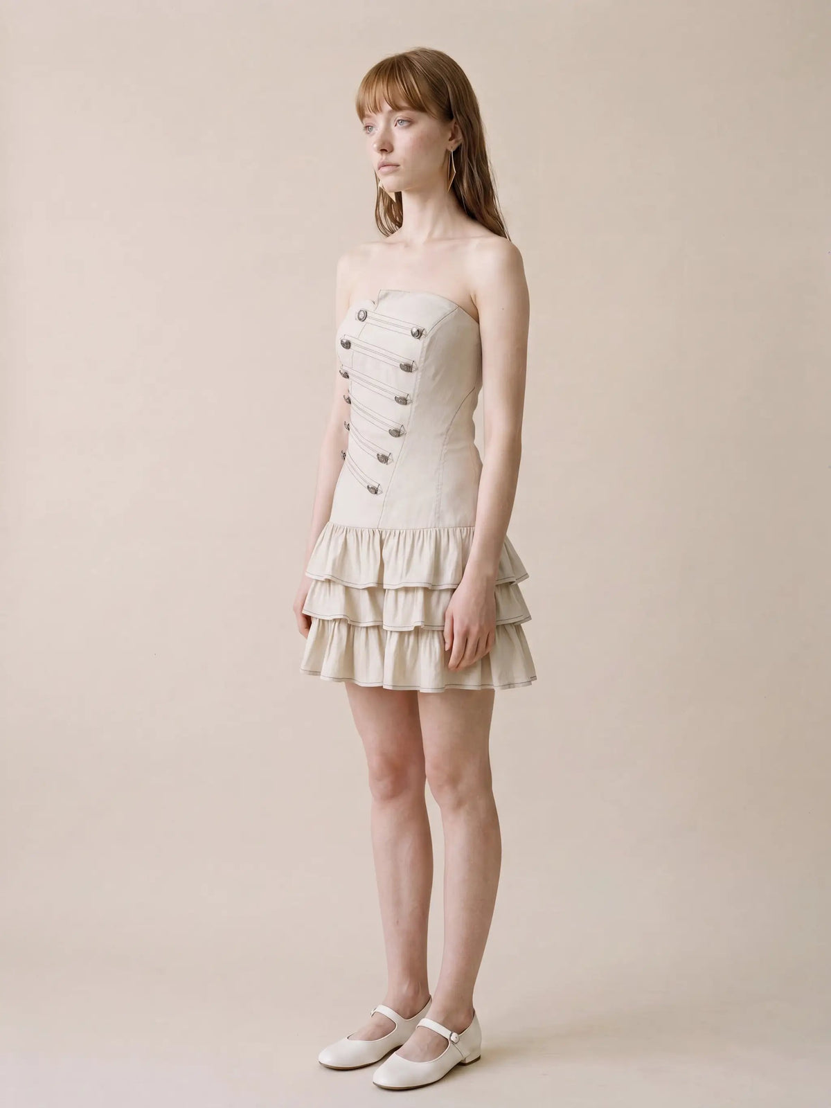 Strapless corset-bodice cotton-linen dress with tiered ruffle hem in beige and metal button detailing