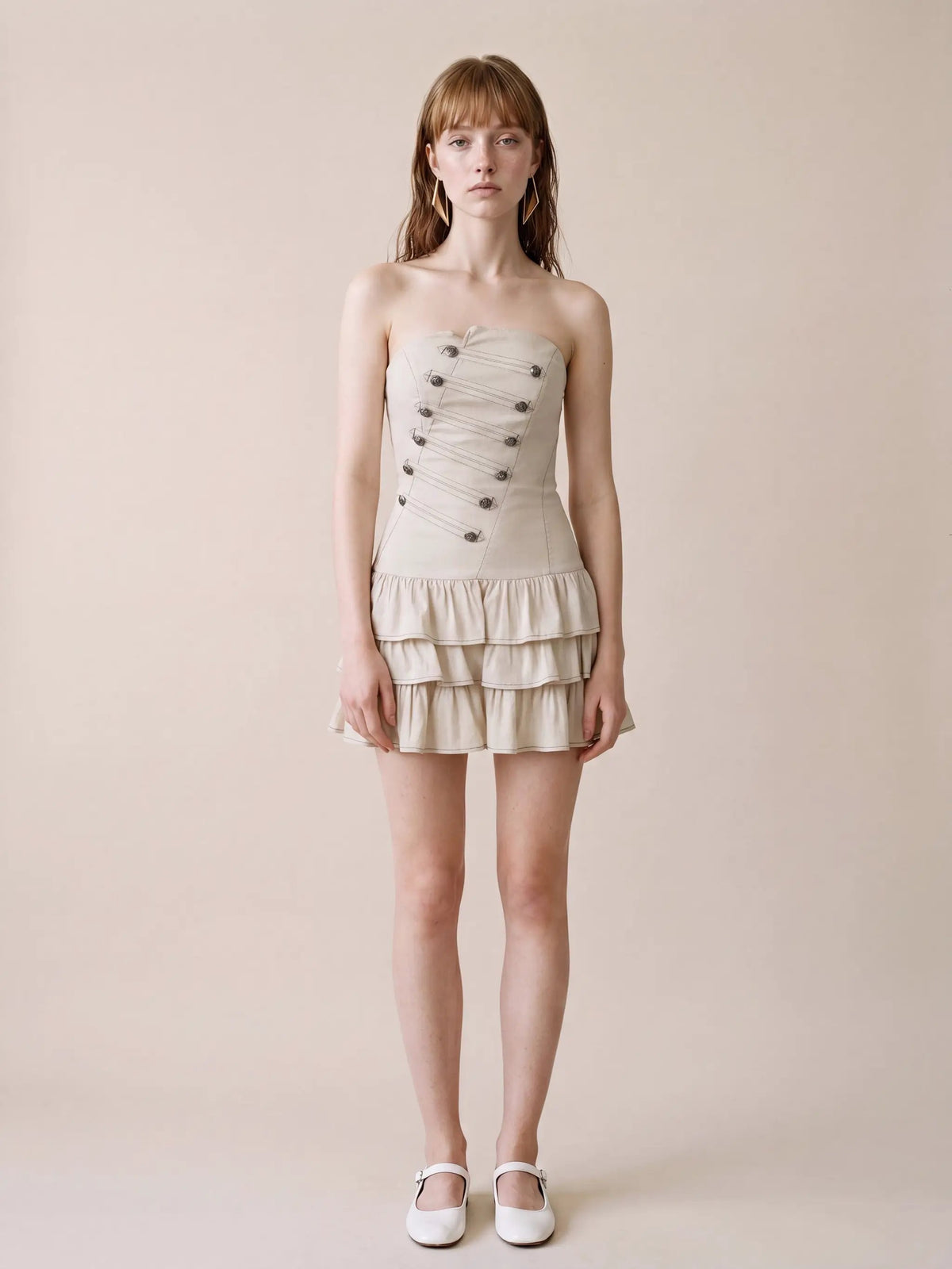 Strapless corset-bodice cotton-linen A-line dress with tiered hem in beige.