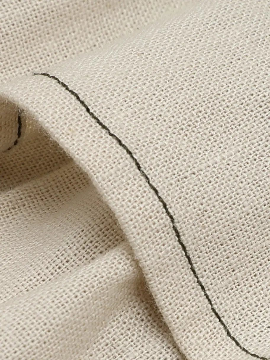 Strapless corset bodice cotton-linen dress with beige textured fabric and a dark seam along the edge