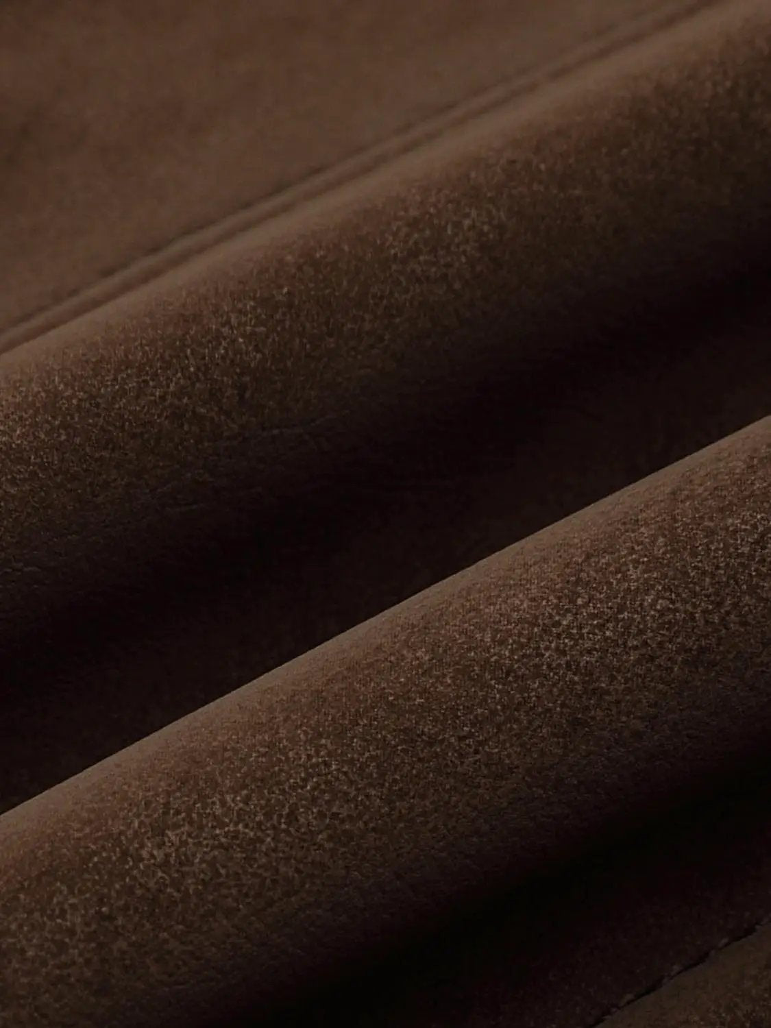 Lace-up faux suede corset dress fabric in brown; close-up textured suede