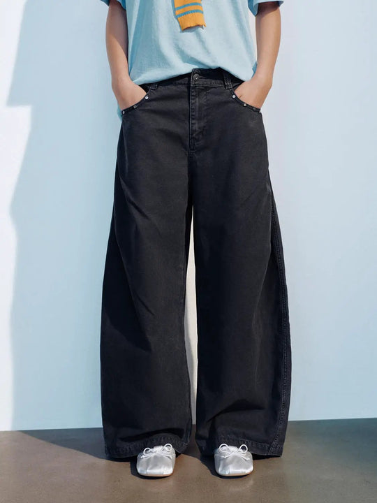 Pantaloni neri oversize in cotone a vita bassa e gamba larga