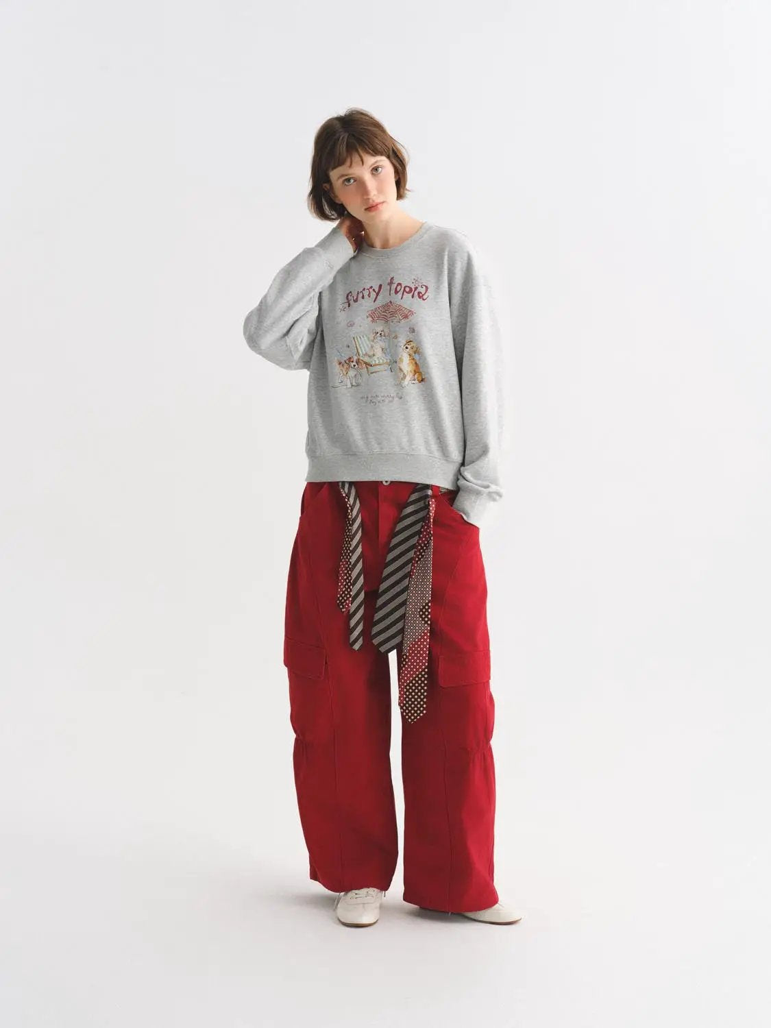 Casual pants, red cargo wide-leg with waist belt ties, worn with a gray graphic sweatshirt