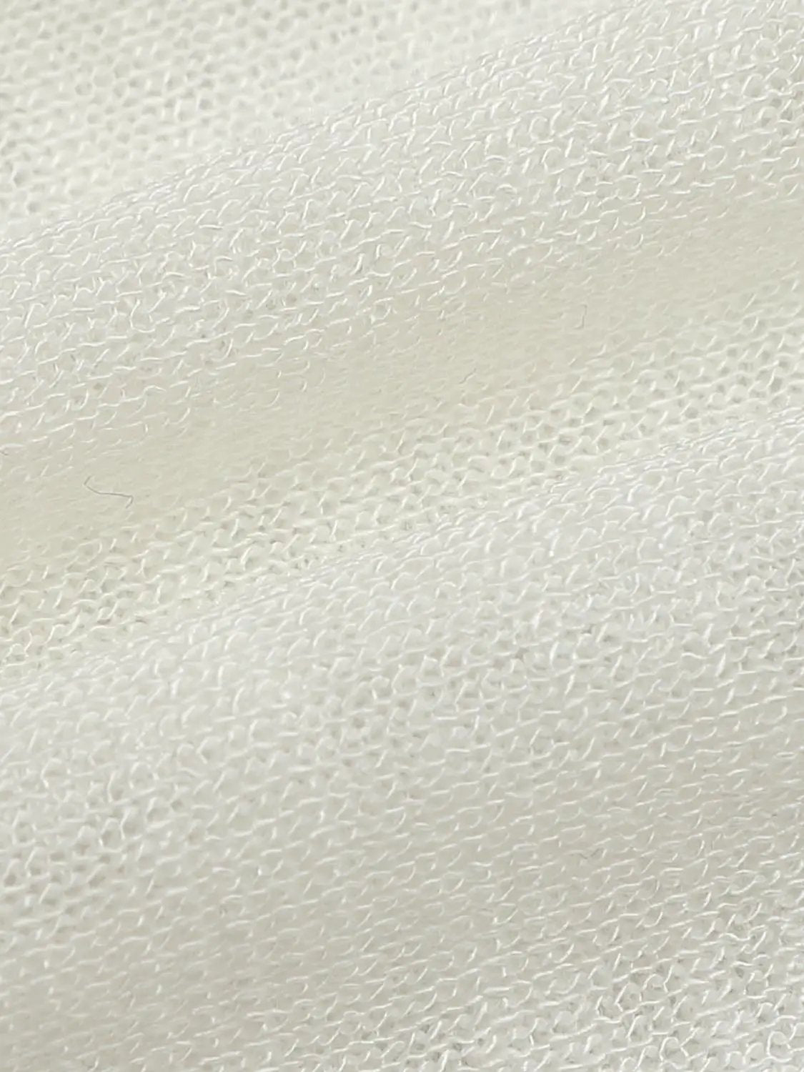 Knit T-Shirt cream knit fabric close-up showing textured loops.