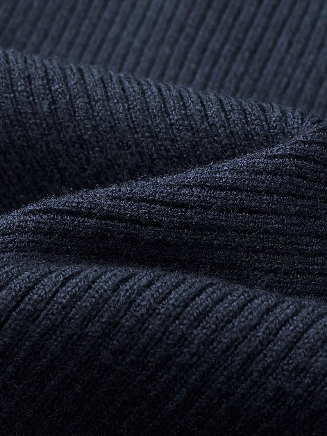 Knit T-Shirts dark navy ribbed knit fabric close-up, textured.