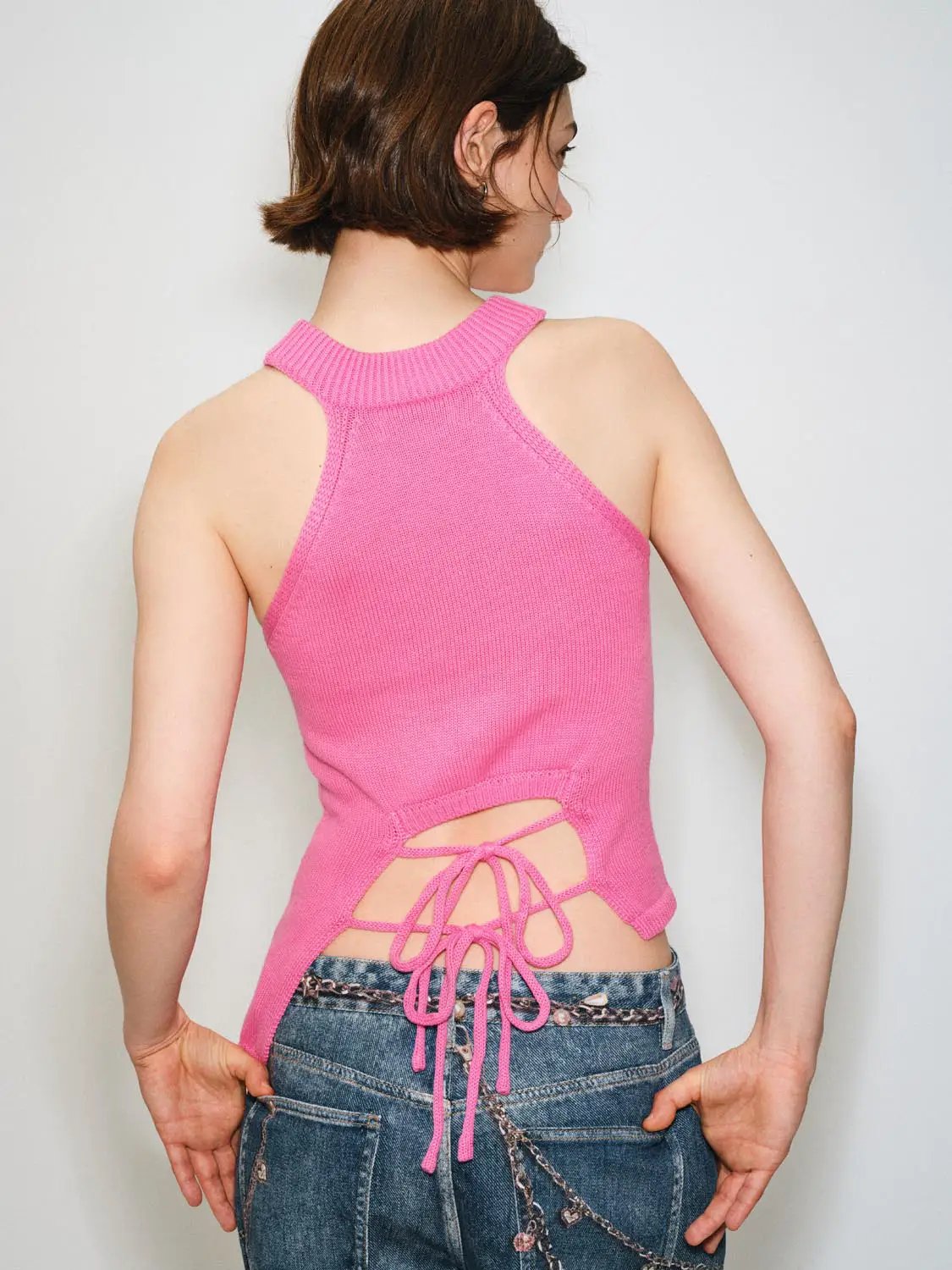Knit T-Shirt in pink with a back lace-up halter design; knitted fabric by Urban Revivo Fashion.