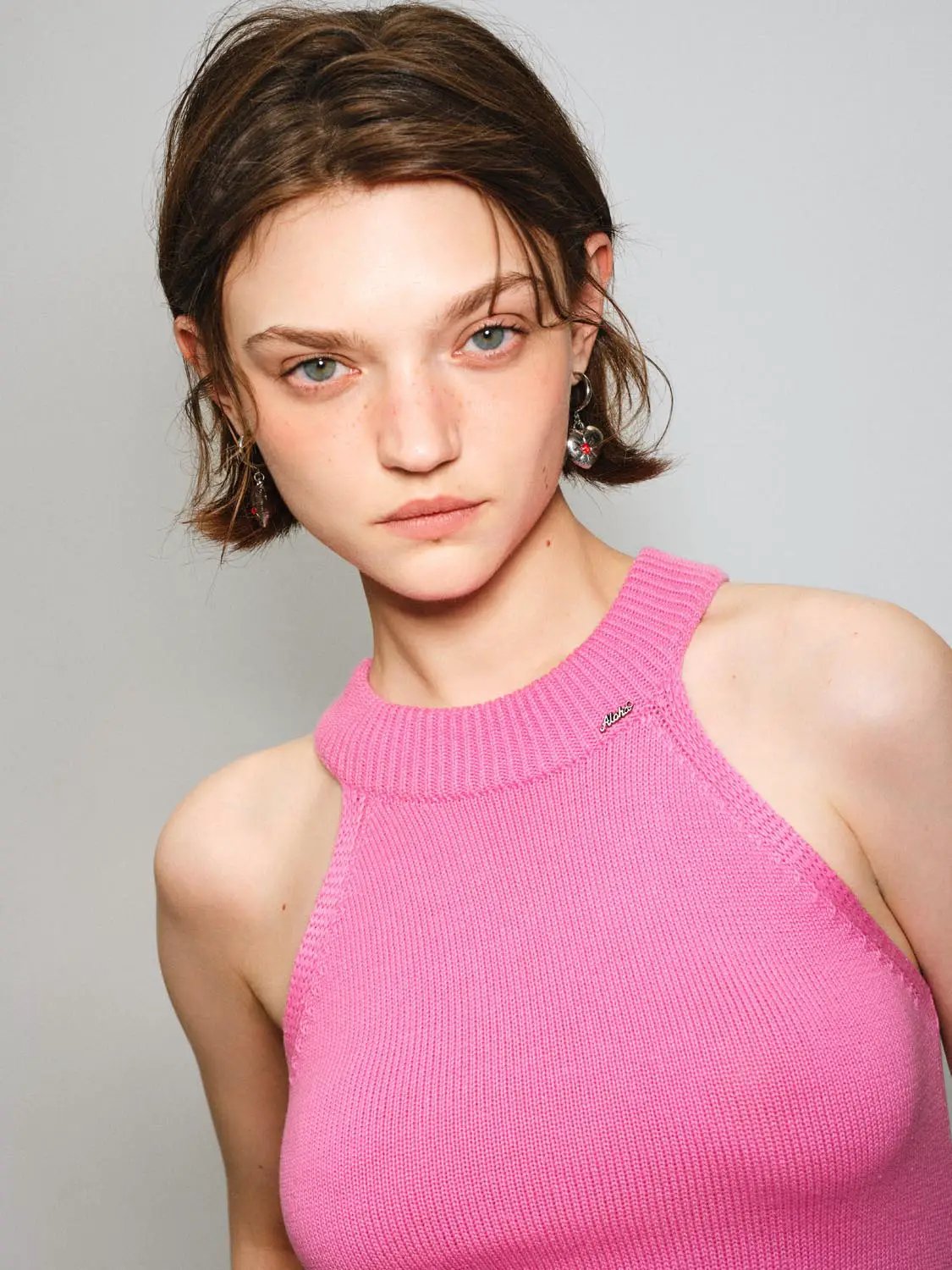 Knit T-Shirt in pink ribbed knit, sleeveless top with high neckline worn by model