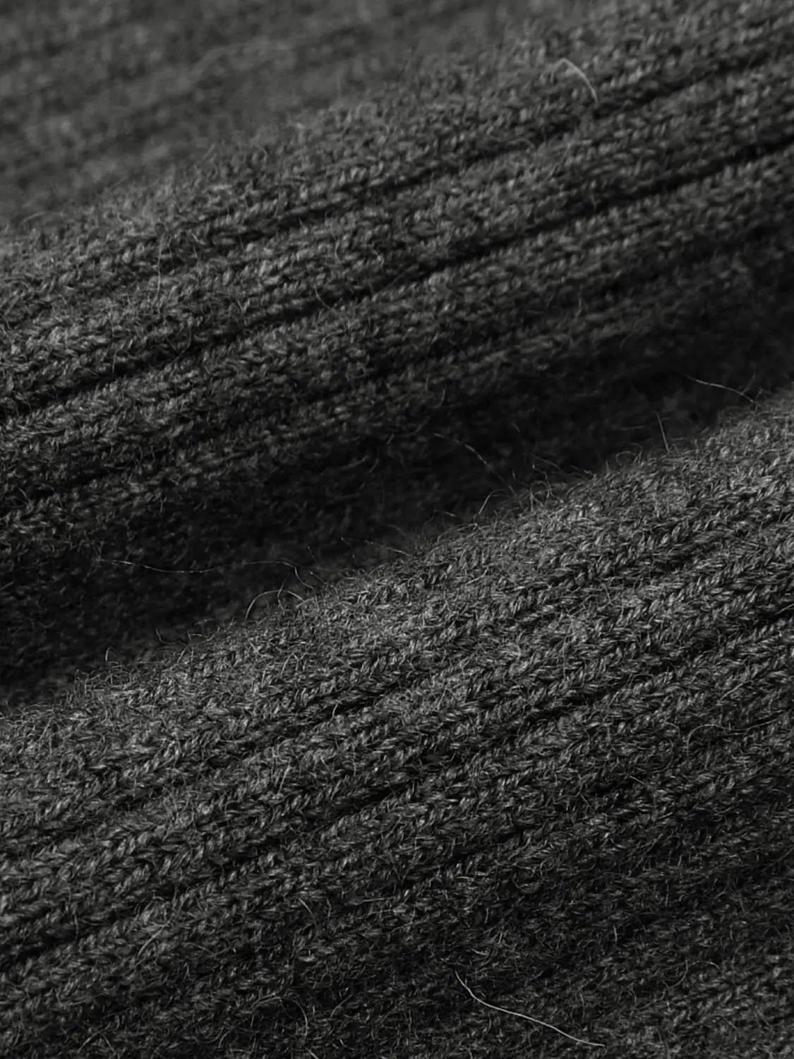 Knit T-Shirt fabric close-up in dark charcoal knit texture