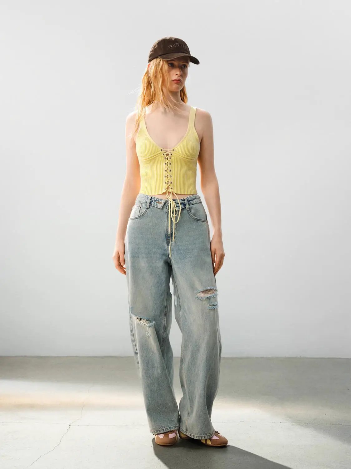 Ribbed Lace-up Sleeveless Cotton Cami Top in yellow, worn with light-wash jeans.