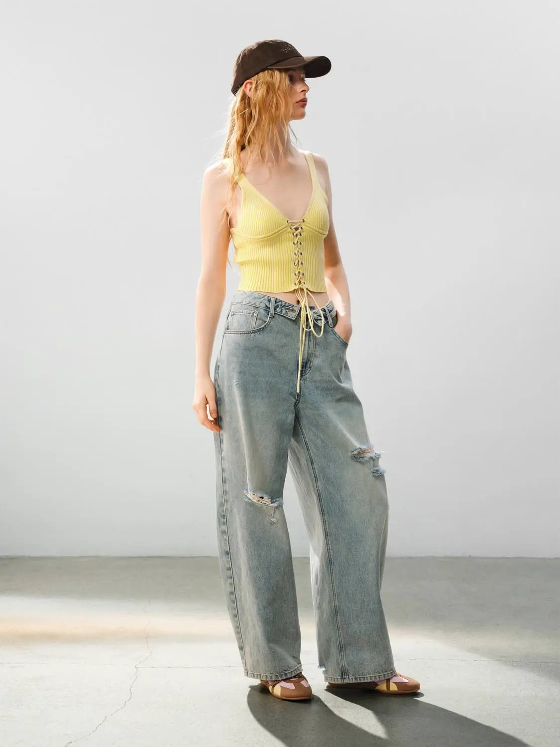 Ribbed lace-up sleeveless cotton cami top, yellow, paired with light-wash distressed wide-leg jeans.