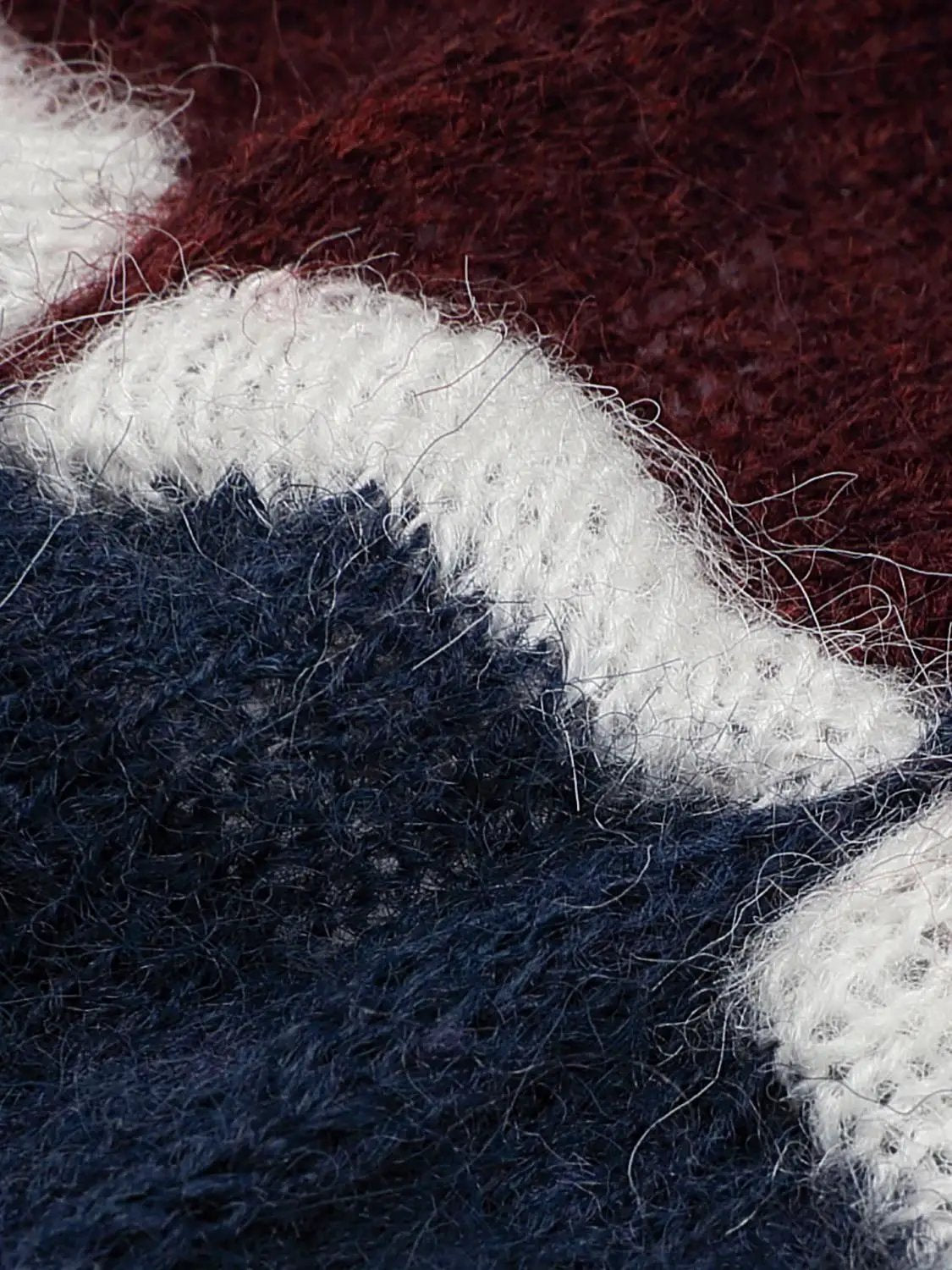 Cropped Striped Textured Long Sleeve Knit Sweater closeup in navy, white, and burgundy yarn.