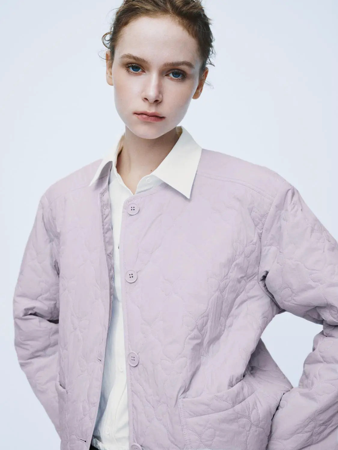 Padded jacket lavender quilted fabric with button front.