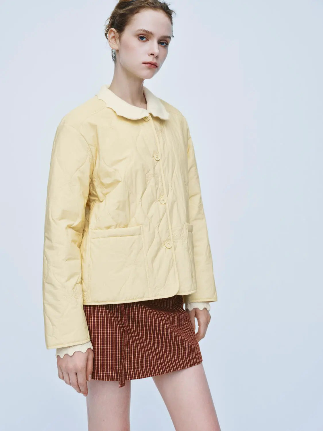 Padded Jacket pale yellow by Urban Revivo Fashion, quilted with front pockets and button closure.