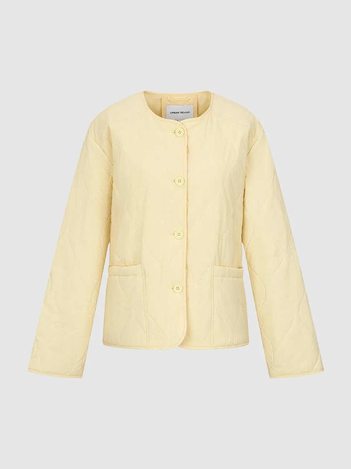 Padded jacket pale yellow with quilted floral pattern, front button closure and patch pockets; Urban Revivo.