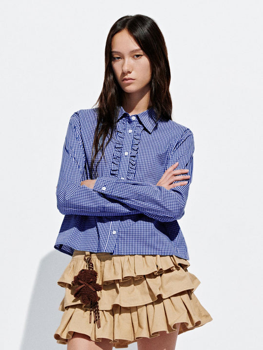 Hemd mit Rüschen-Saum überprüfen