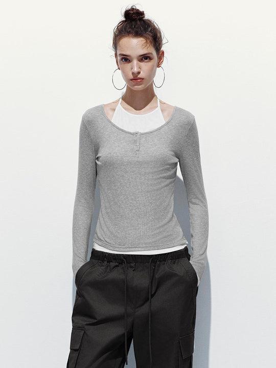 Camisetas de manga larga con botón en la parte superior