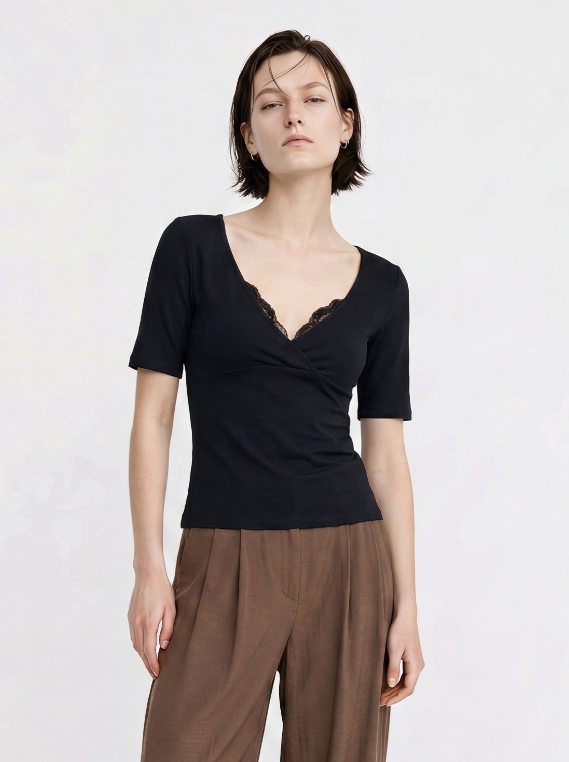 Cotton jersey knit wrap V-neck T-shirt in black with lace-trim and draped front, short sleeves