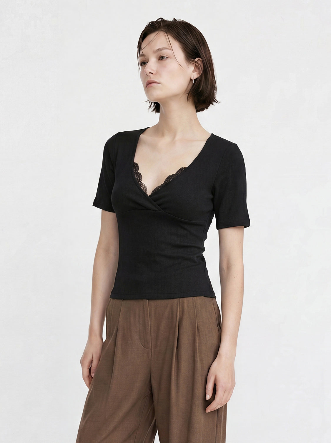 Black cotton jersey knit short-sleeve wrap V-neck T-shirt with lace-trimmed draped front