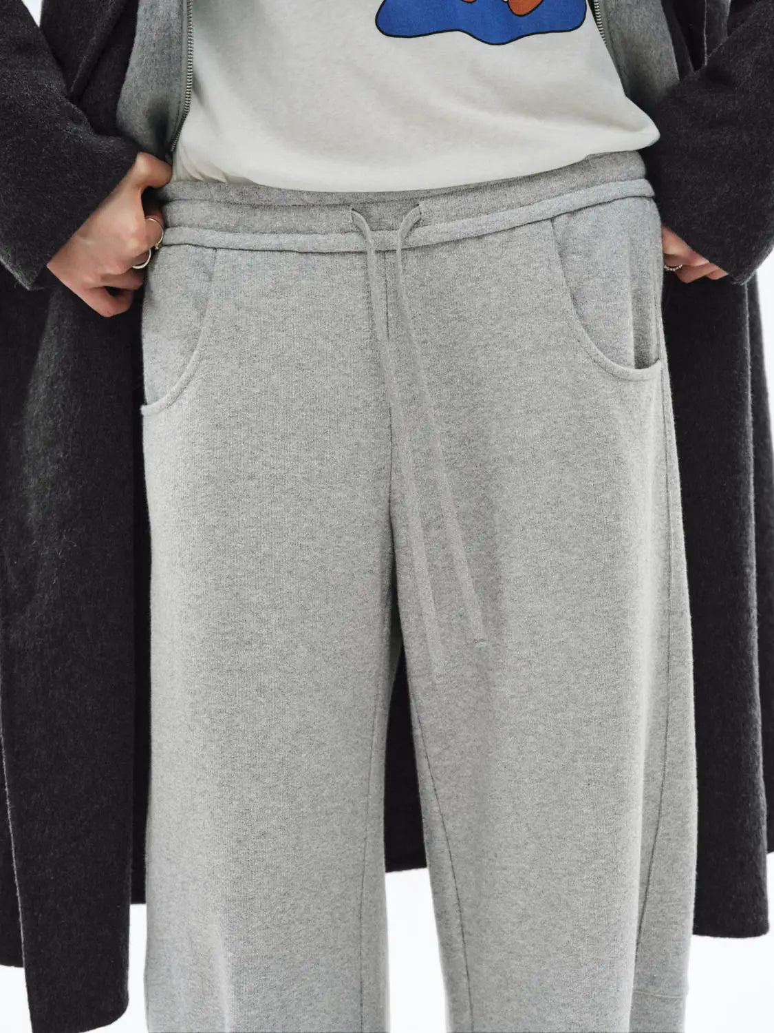 Barrel Leg Pants in light gray fleece with drawstring waist and front pockets.