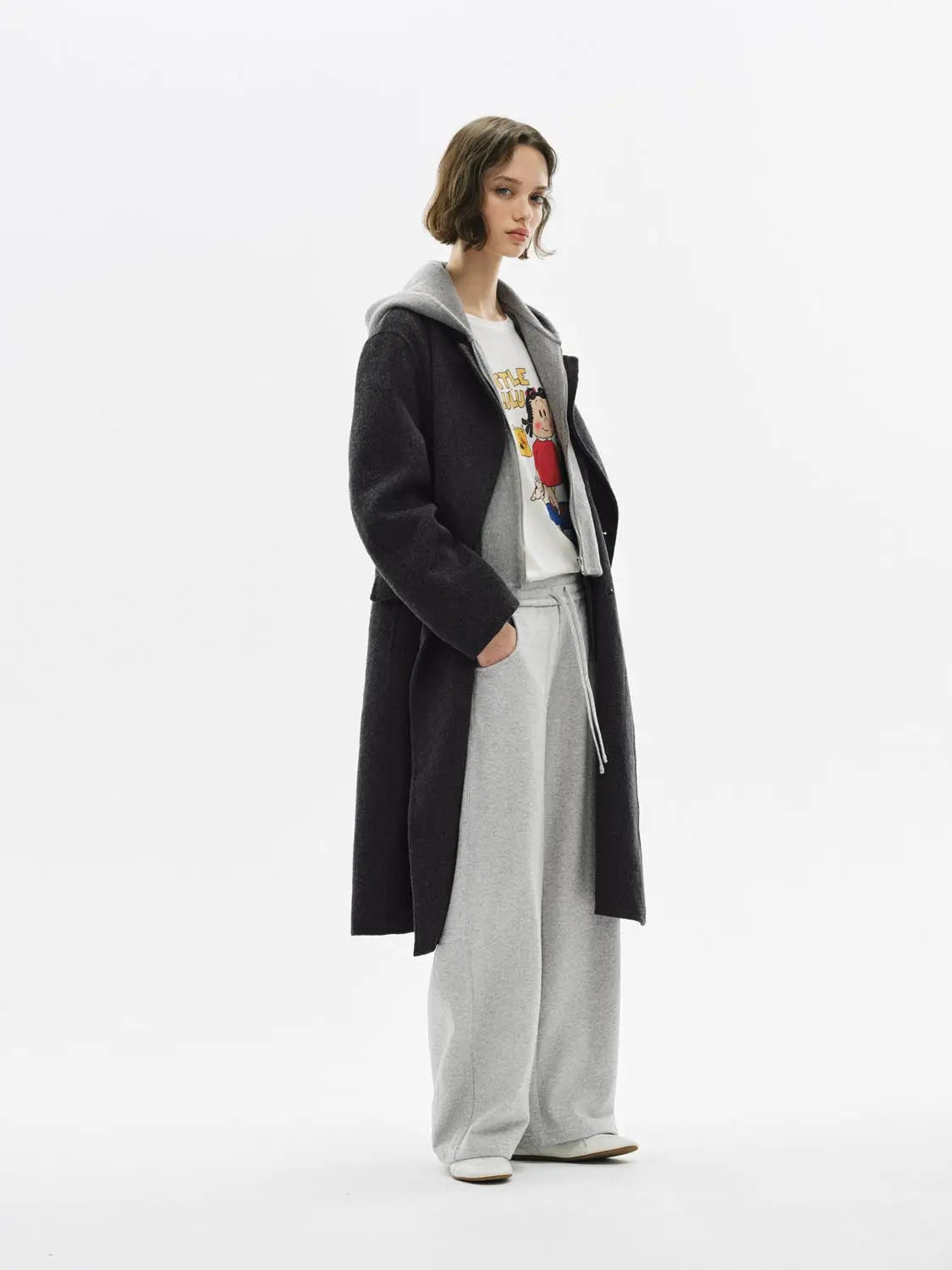 Barrel-Leg Pants, light gray, shown on model with a dark long coat and hoodie.